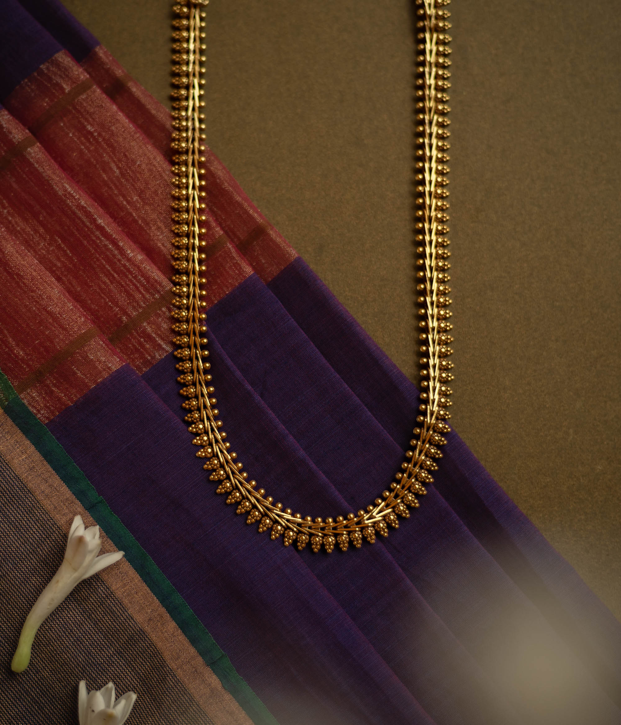 Gold-tone traditional necklace with vine and bud motifs from the Katha Collection.