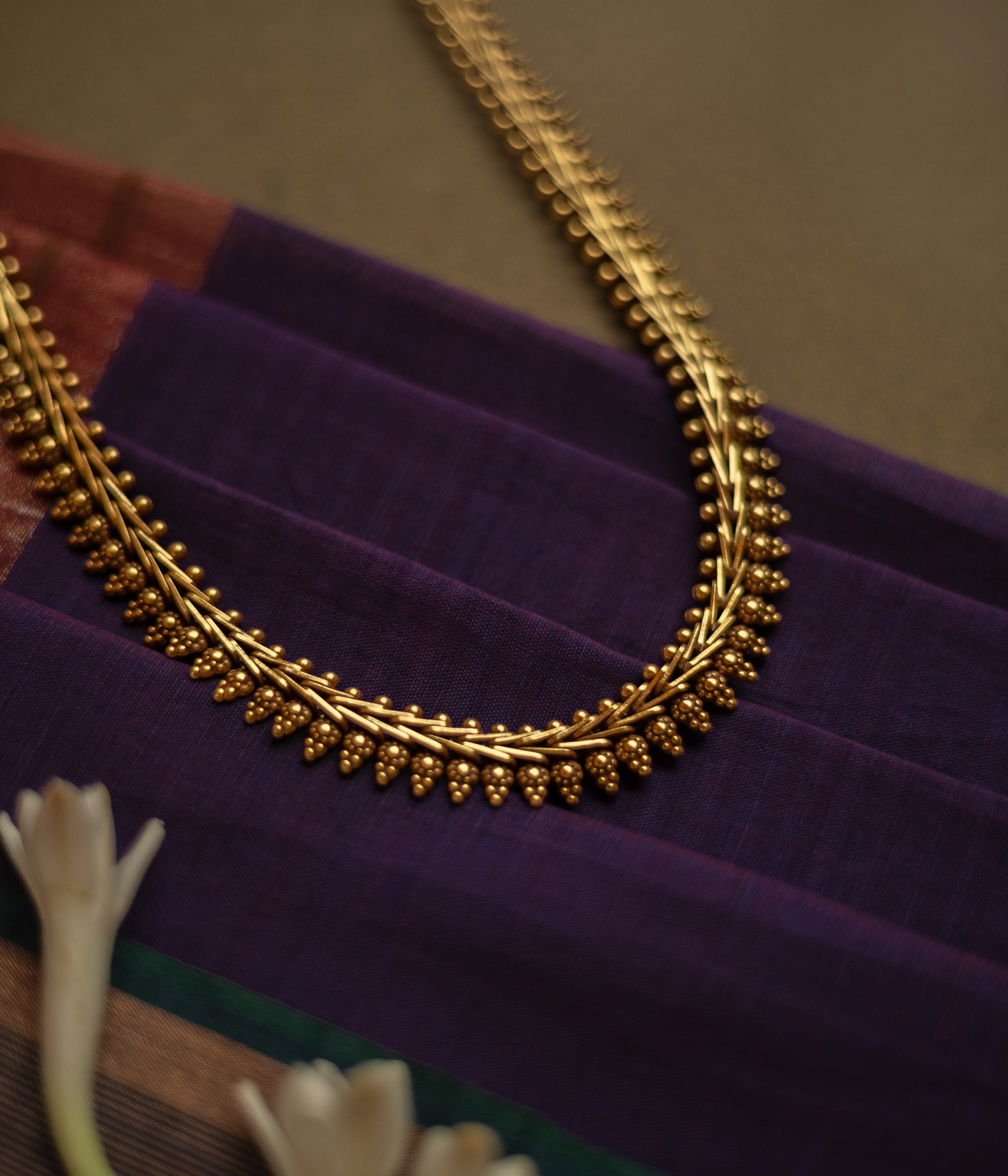 Gold-tone traditional necklace with vine and bud motifs from the Katha Collection.