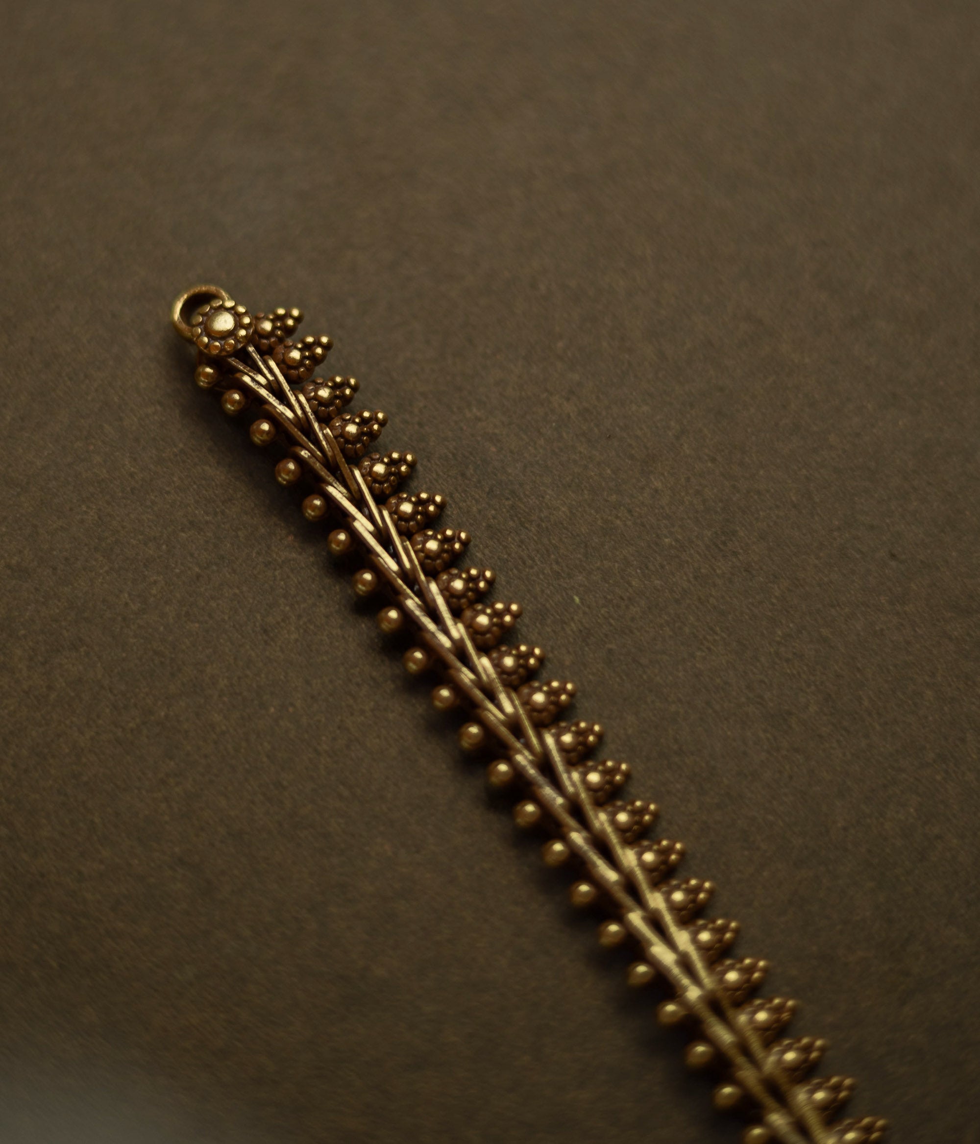 Gold-tone traditional necklace with vine and bud motifs from the Katha Collection.