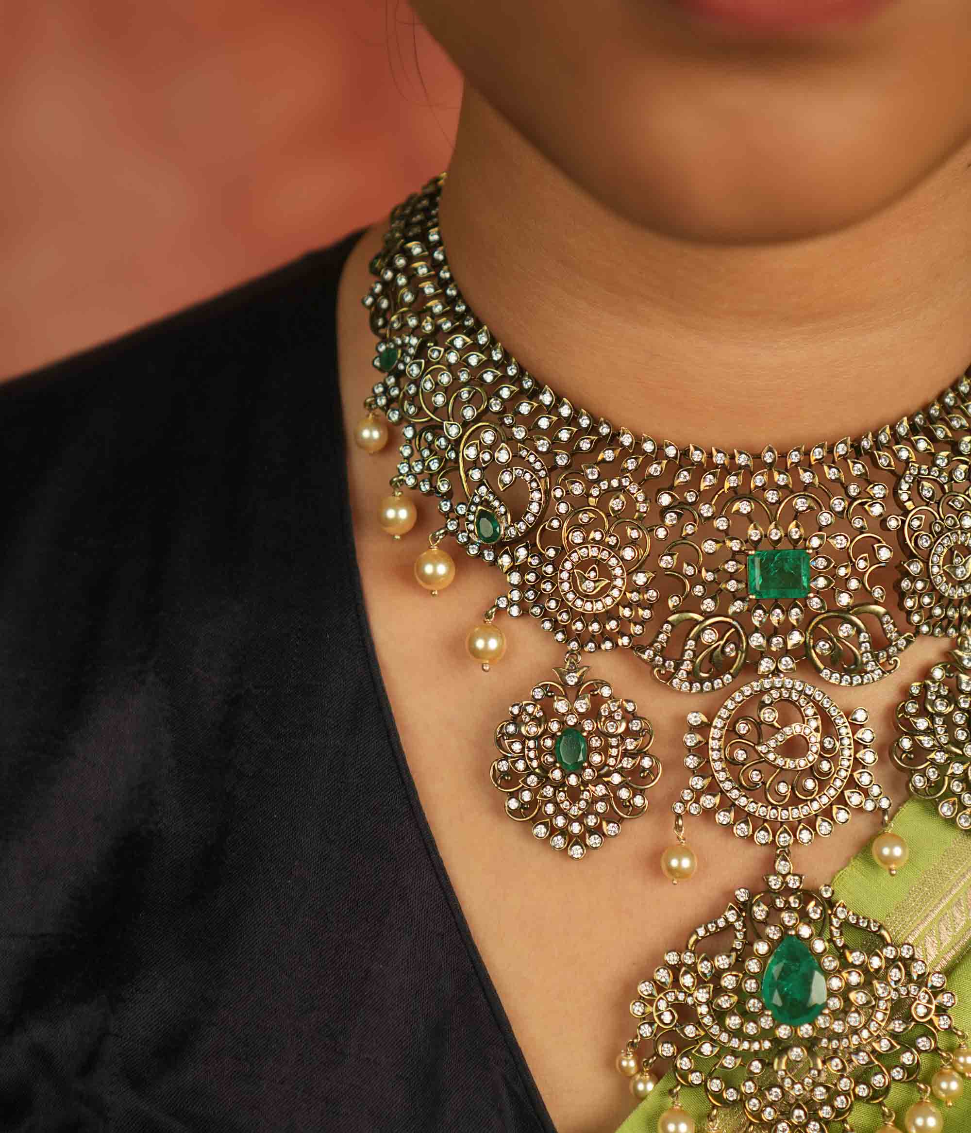 Victorian elegance reborn! This moissanite necklace with floral patterns, green-cut stones, CZ brilliance, and pearl droplets whispers timeless opulence.