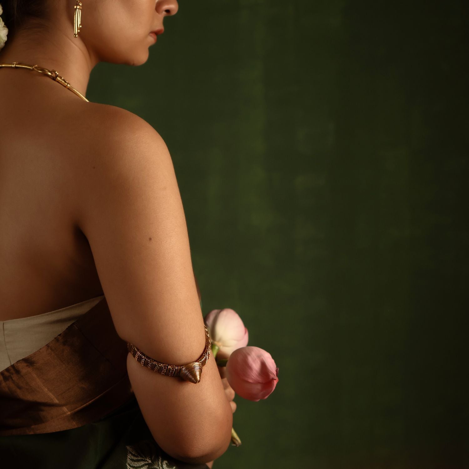 Capture the spirit of tradition with the Tarrah antique tribal gold-plated silver armlet, a perfect blend of rustic charm and enduring elegance.