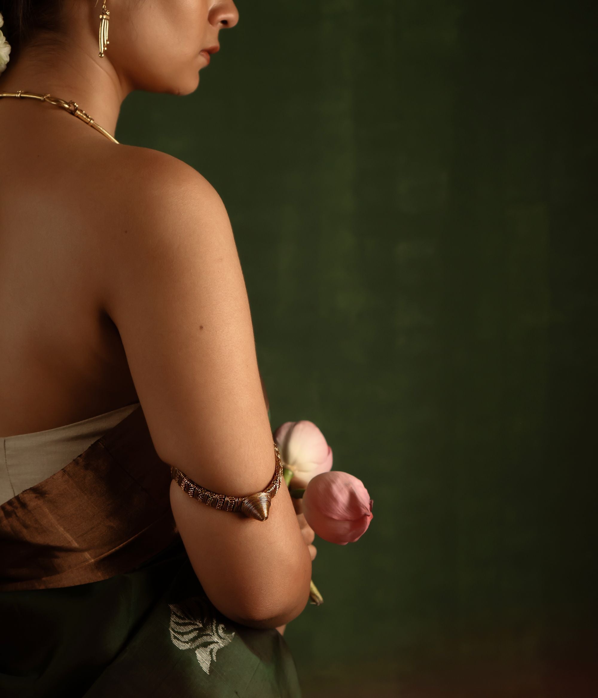 Capture the spirit of tradition with the Tarrah antique tribal gold-plated silver armlet, a perfect blend of rustic charm and enduring elegance.