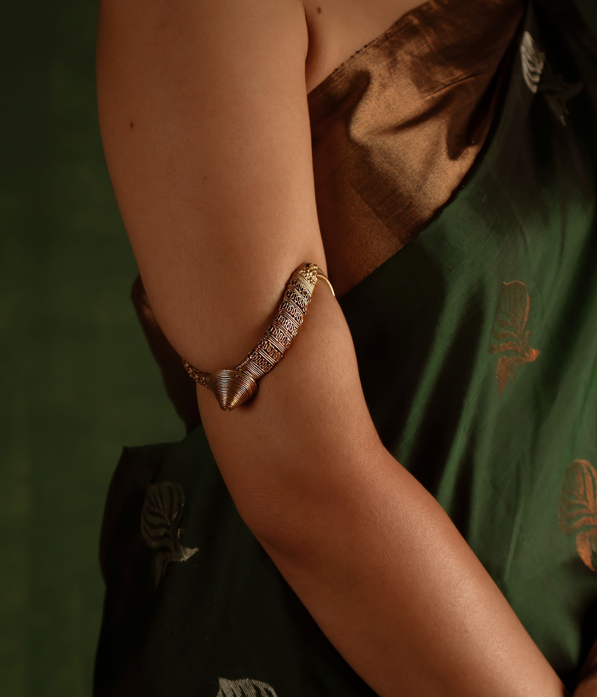 Capture the spirit of tradition with the Tarrah antique tribal gold-plated silver armlet, a perfect blend of rustic charm and enduring elegance.