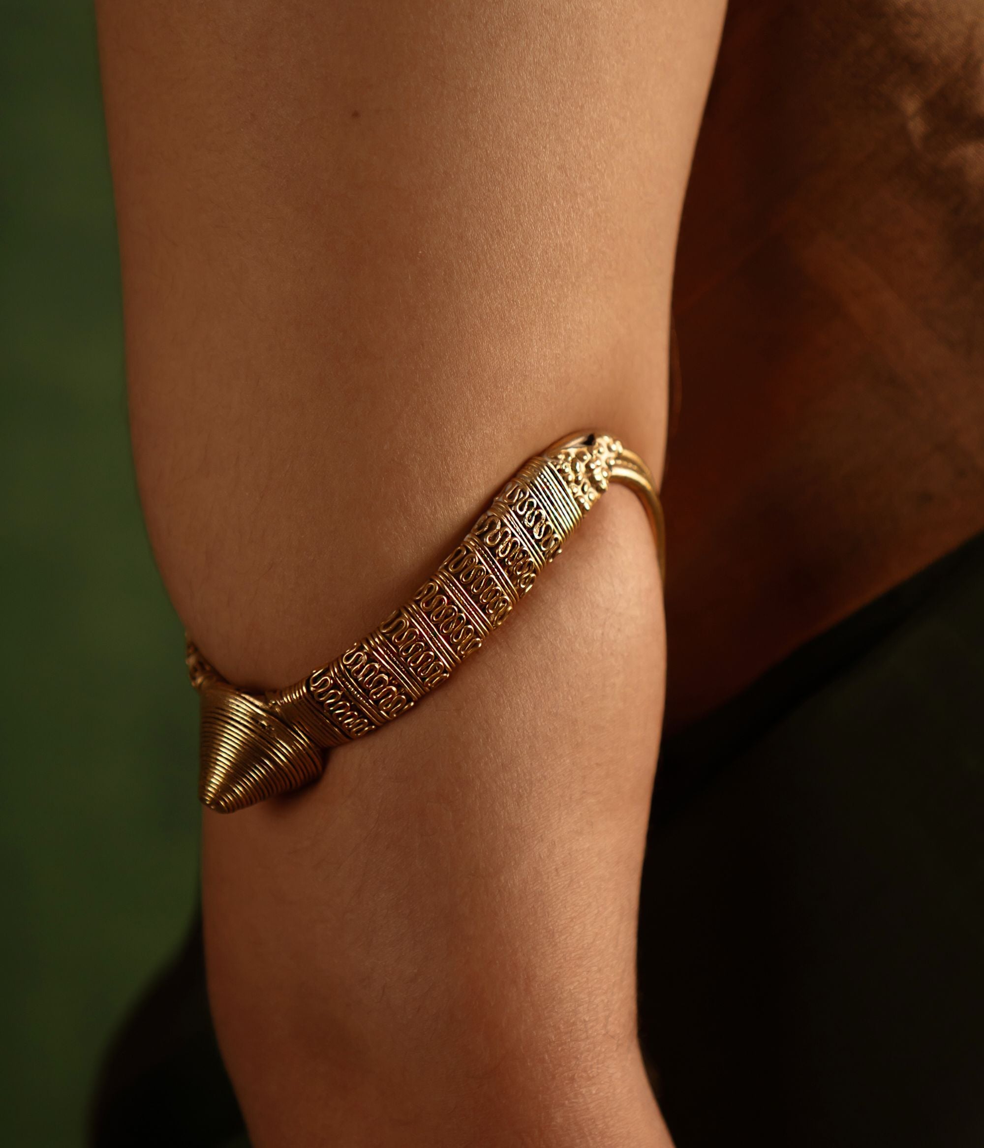 Capture the spirit of tradition with the Tarrah antique tribal gold-plated silver armlet, a perfect blend of rustic charm and enduring elegance.