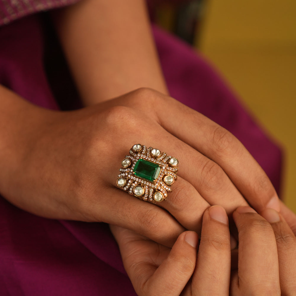 Geometric elegance reborn! A square emerald ring, framed by Moissanite and Polki, blends modern sophistication with timeless charm.