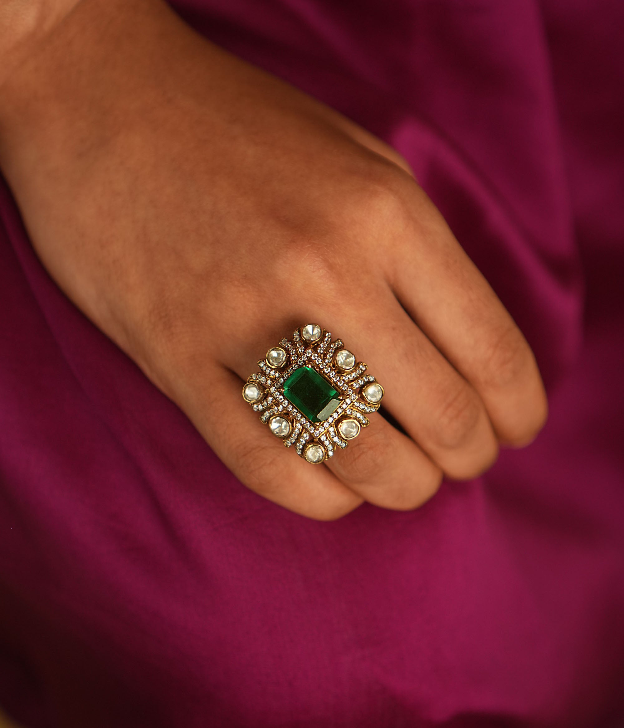 Geometric elegance reborn! A square emerald ring, framed by Moissanite and Polki, blends modern sophistication with timeless charm.