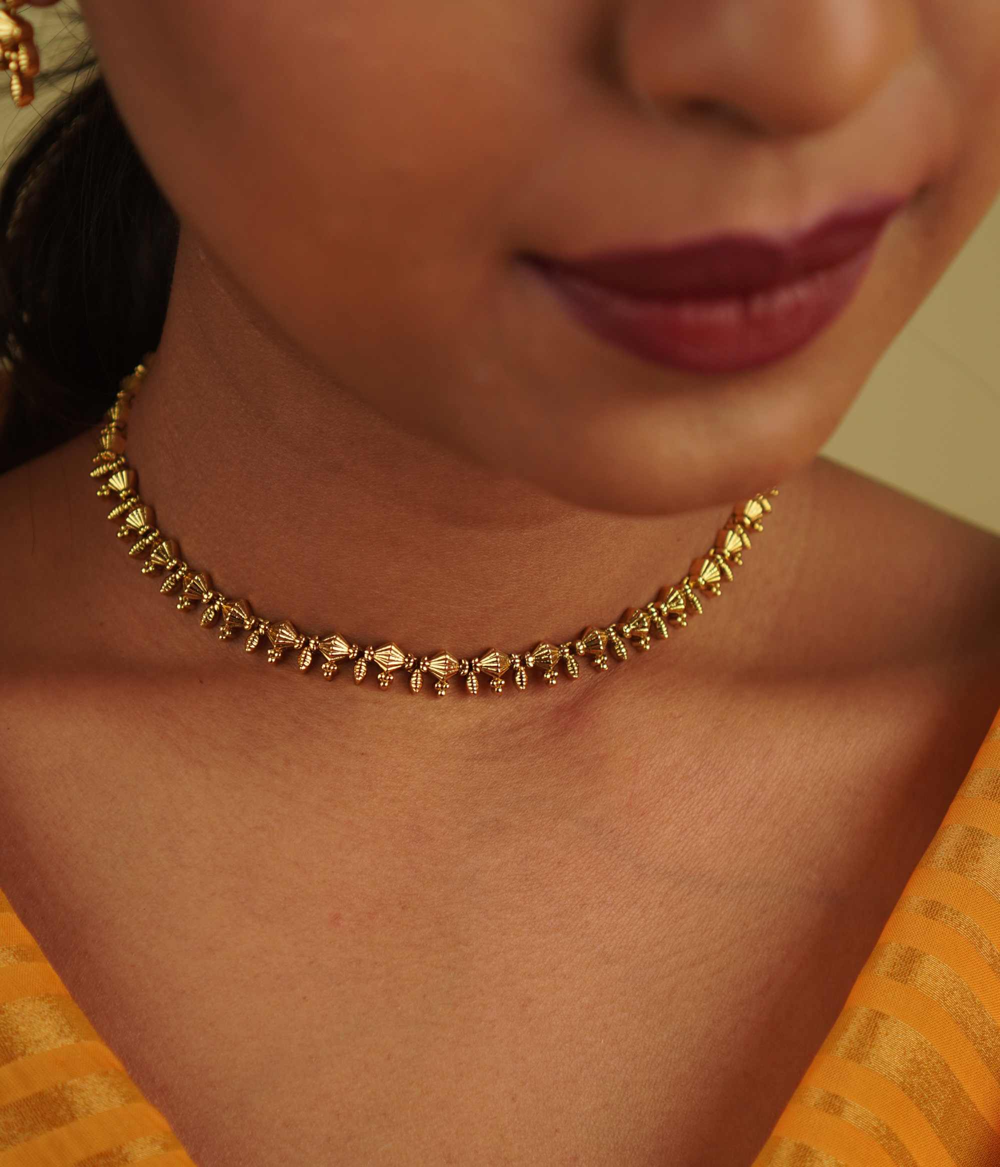 The delicate Ukti necklace seamlessly blends vintage charm with modern elegance, making it a timeless addition to any attire, perfect for every occasion.