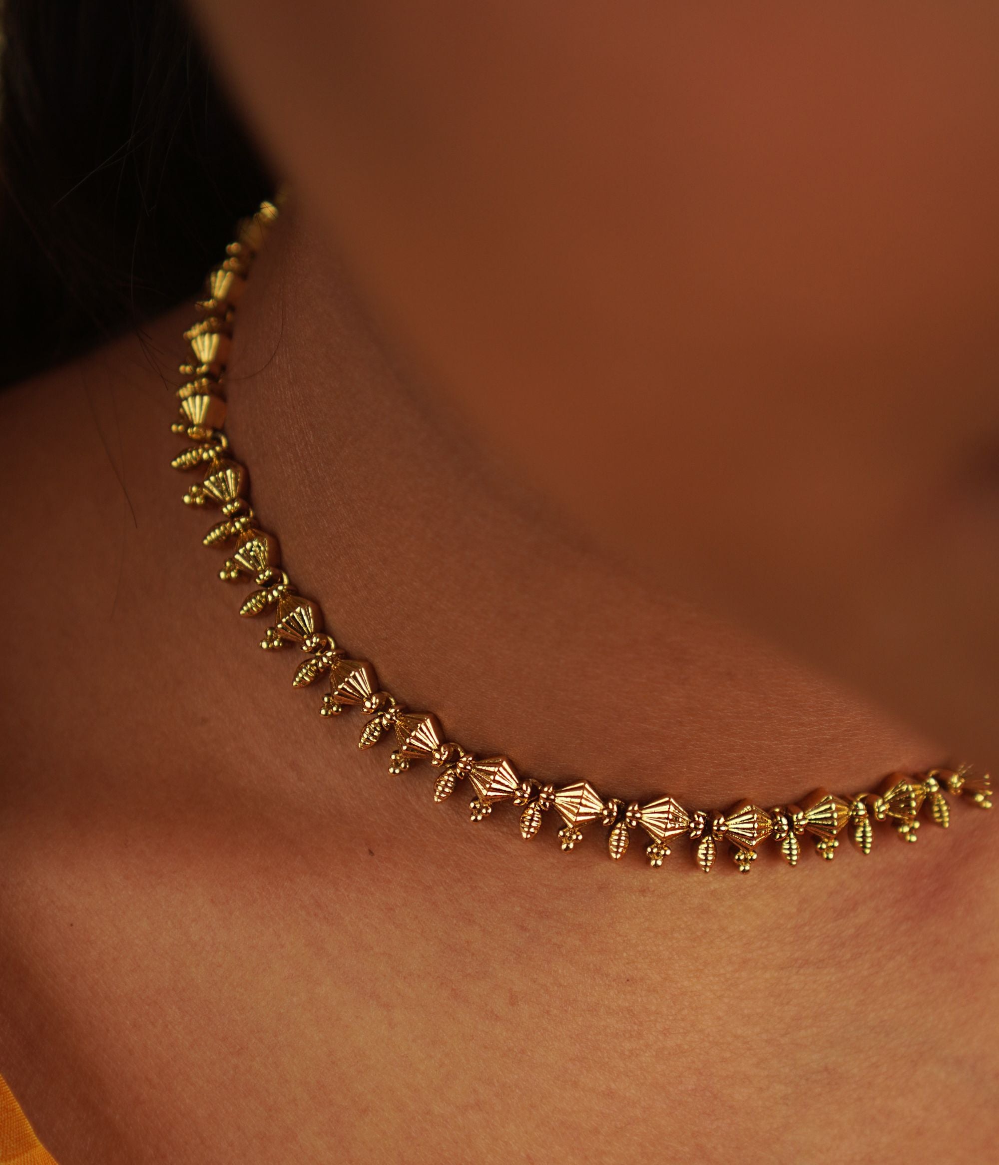 The delicate Ukti necklace seamlessly blends vintage charm with modern elegance, making it a timeless addition to any attire, perfect for every occasion.