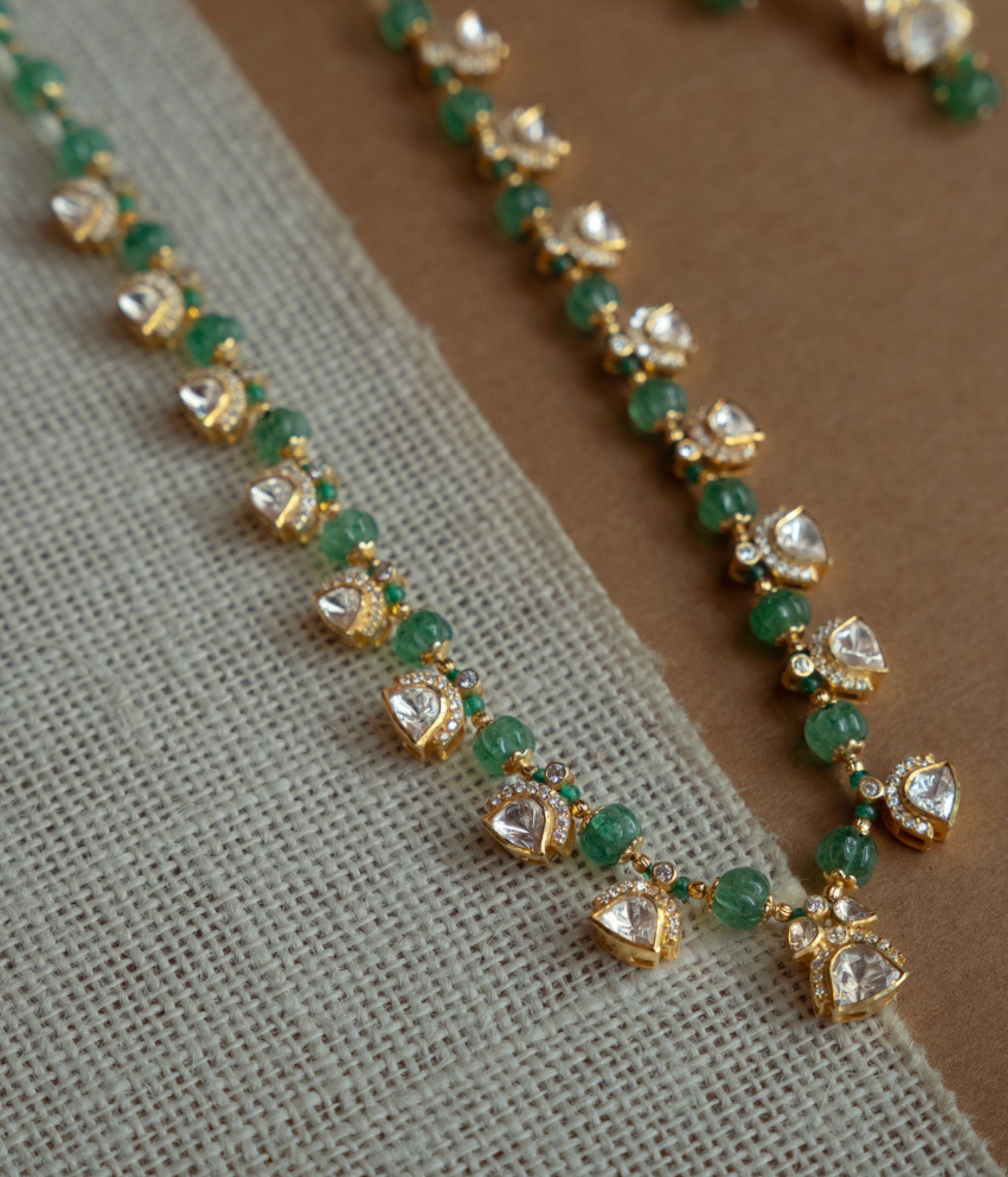 Elegant white polki silver necklace with green beads for saree styling