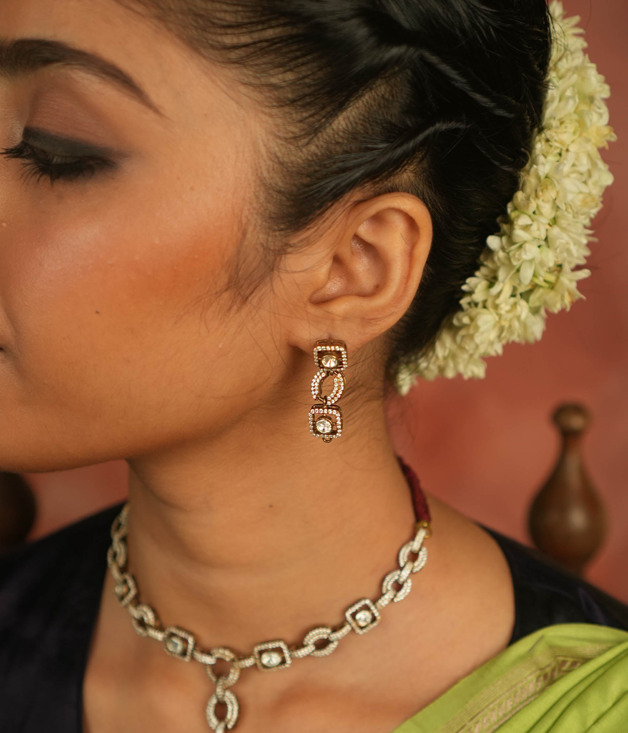 Geometric whispers reborn! Polki and CZ drop earrings shimmer with modern elegance, offering timeless luxury for the minimalist connoisseur.