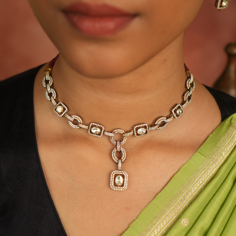 Geometric whispers reborn! This Polki and CZ stone necklace radiates modern elegance, a timeless expression of luxury for the minimalist connoisseur.