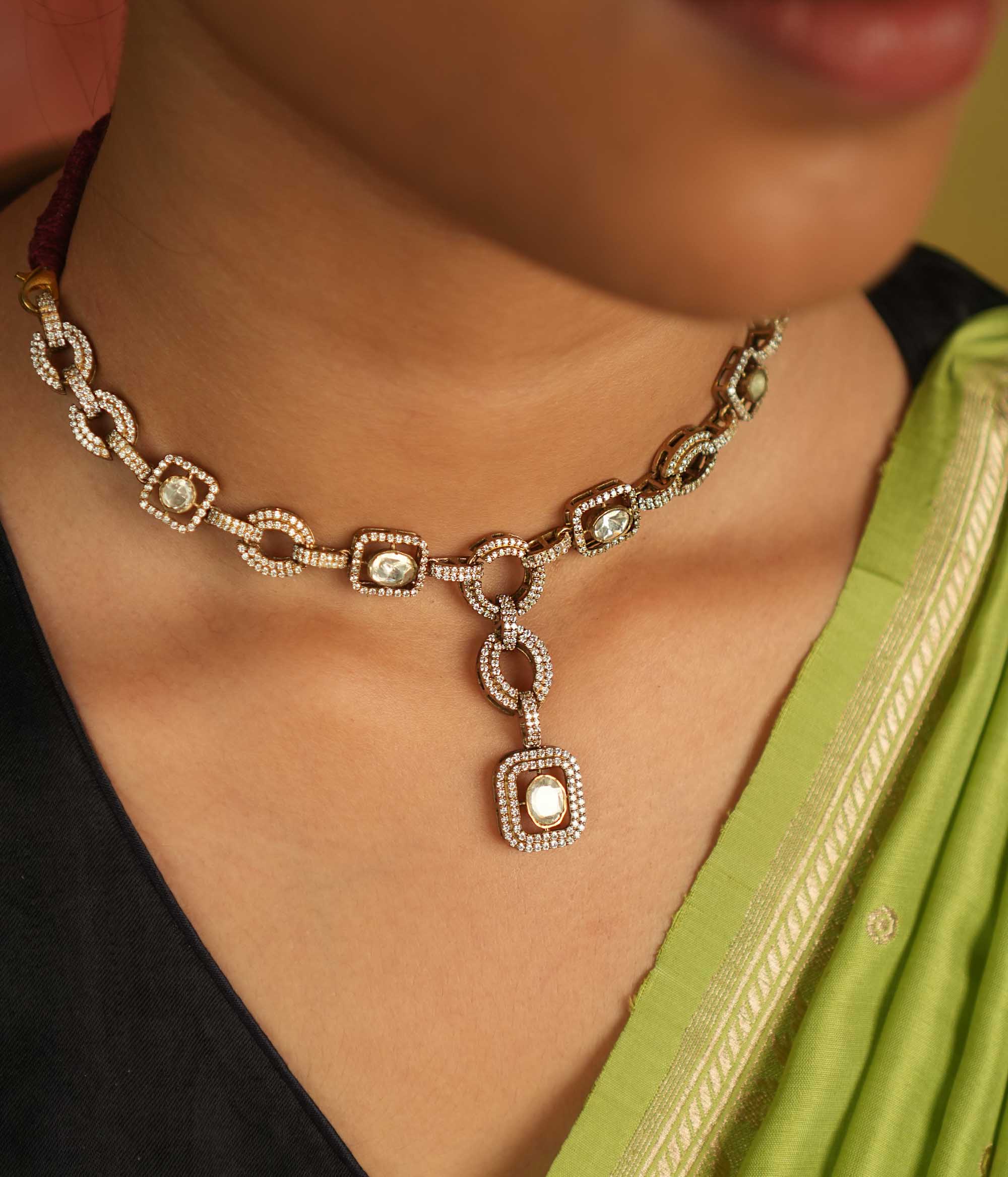Geometric whispers reborn! This Polki and CZ stone necklace radiates modern elegance, a timeless expression of luxury for the minimalist connoisseur.