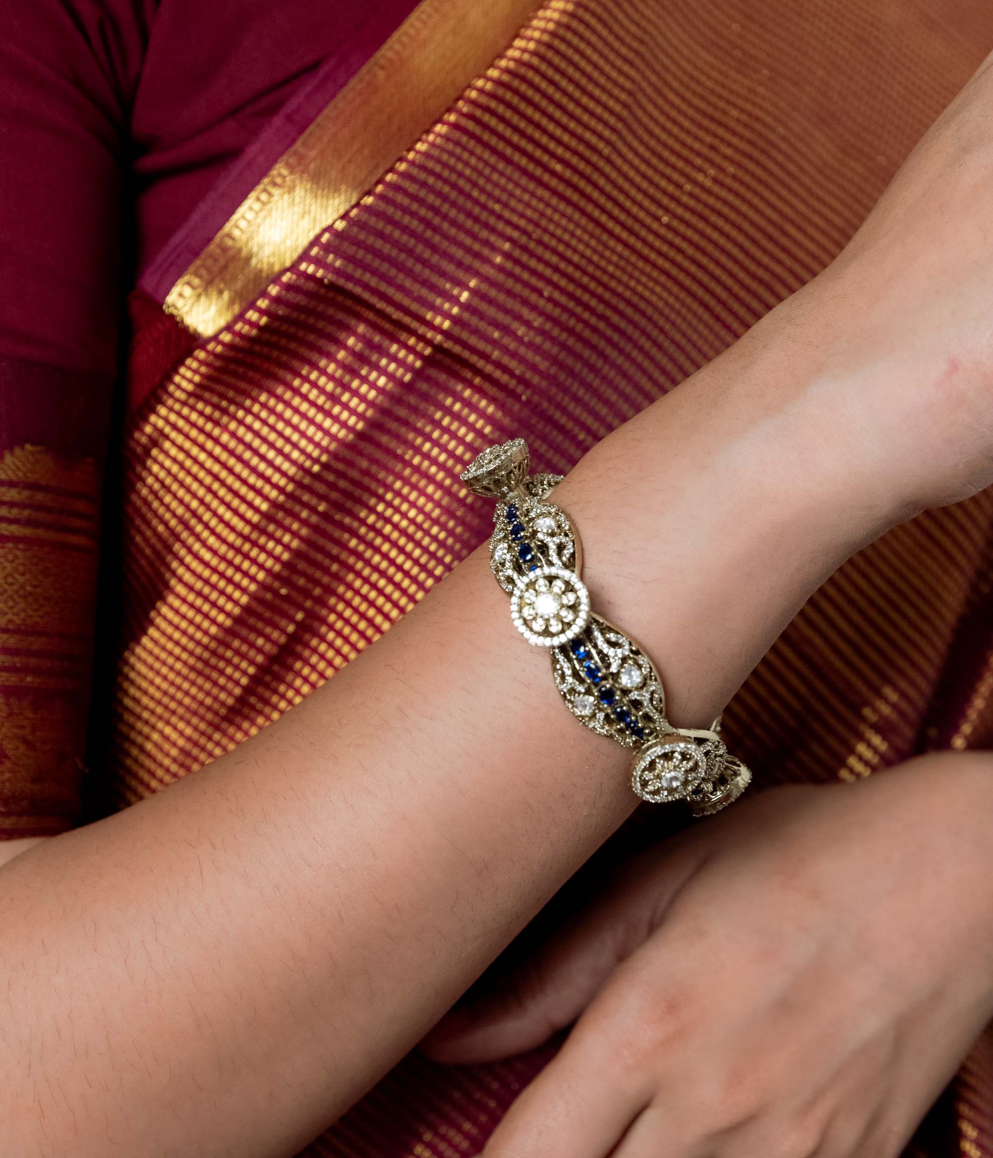 Victorian-style bangle adorned with Polki and CZ stones. Seamlessly blends classic elegance with contemporary flair.