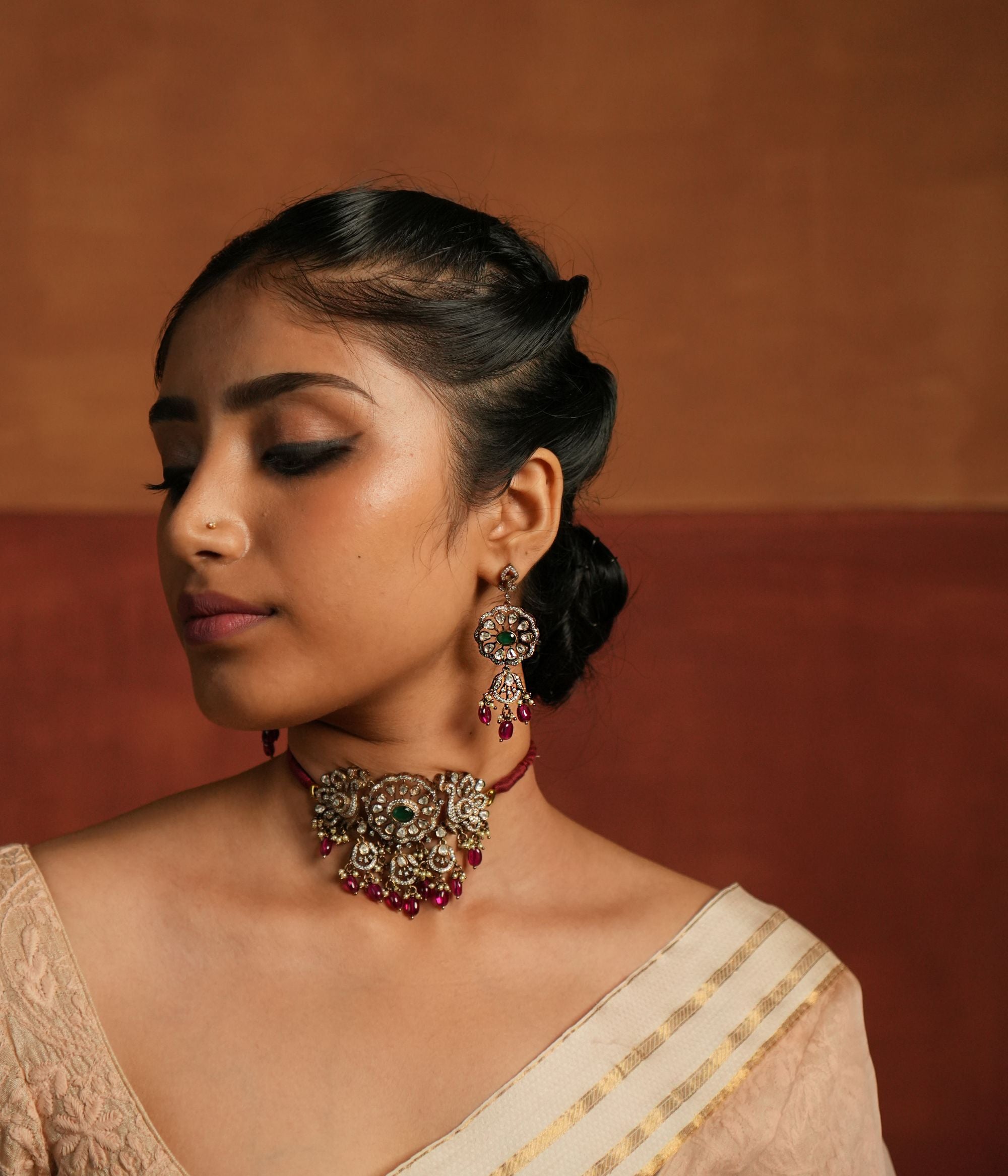 Close-up of Layla Choker with green gemstones, polki, CZ stones