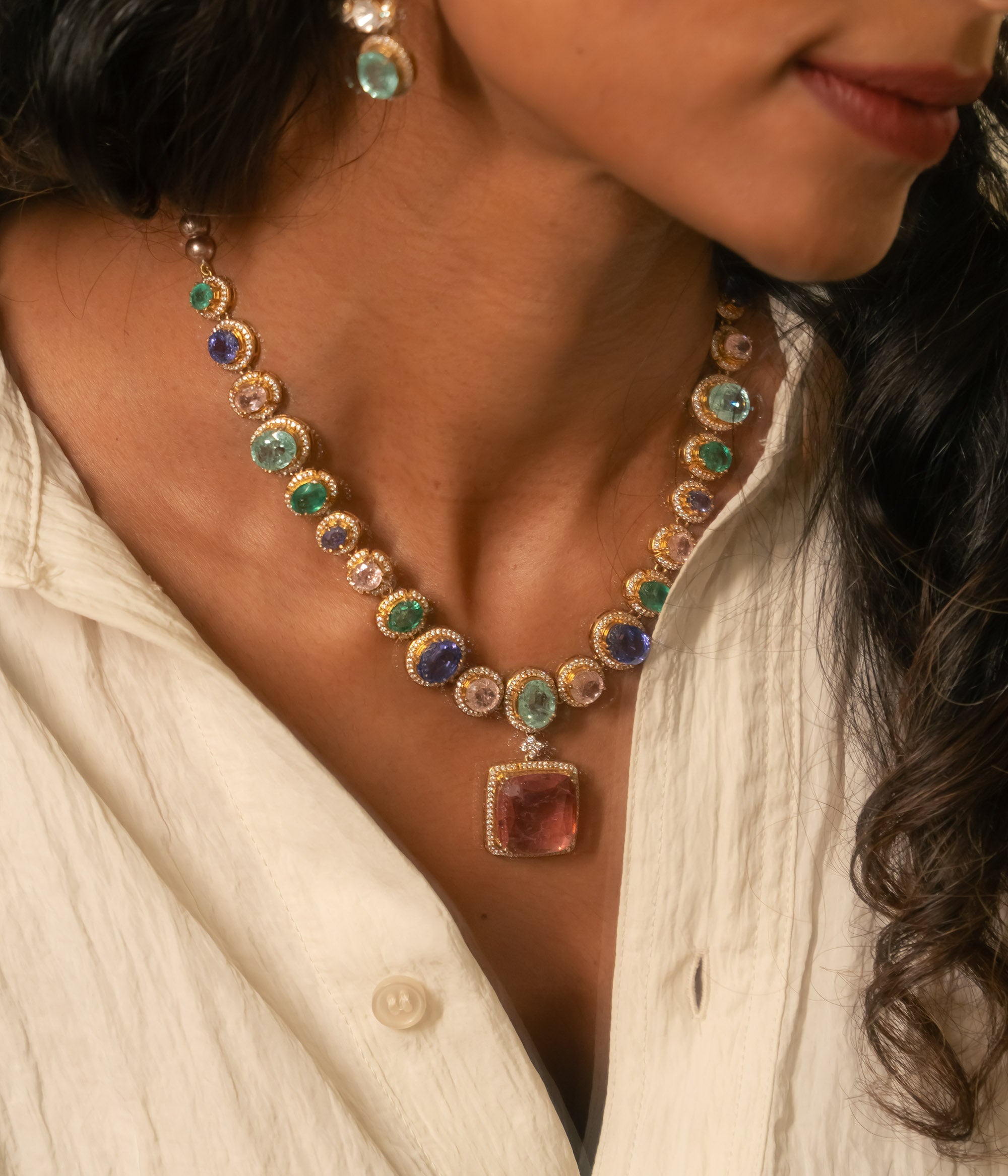 Victorian-style necklace with colorful gemstones, Moissanite Polki, and red central pendant.
