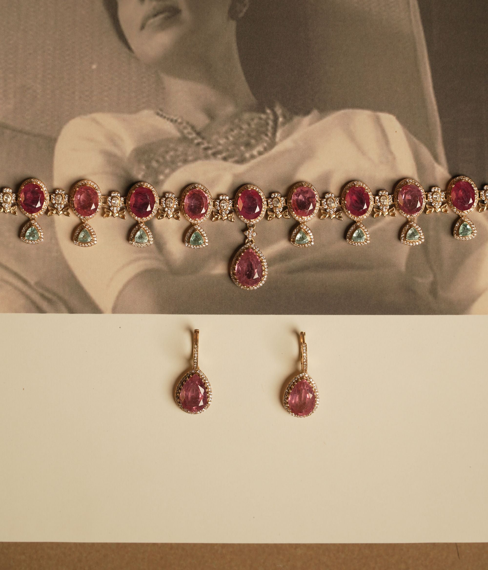 Victorian necklace with red Polki stones, green Polki drops, and CZ floral detailing in gold finish.