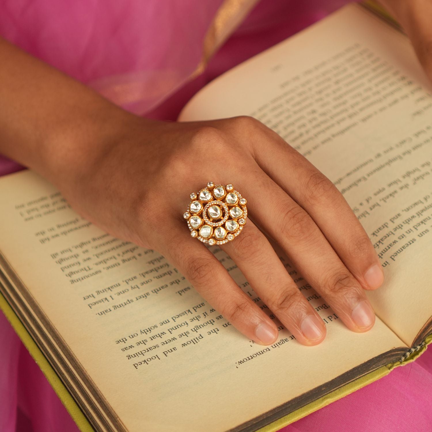 In a realm of opulence, this minimalist floral ring shines with the delicate beauty of Polki stones and the sparkle of shimmering Moissanite, creating a refined yet extravagant piece.