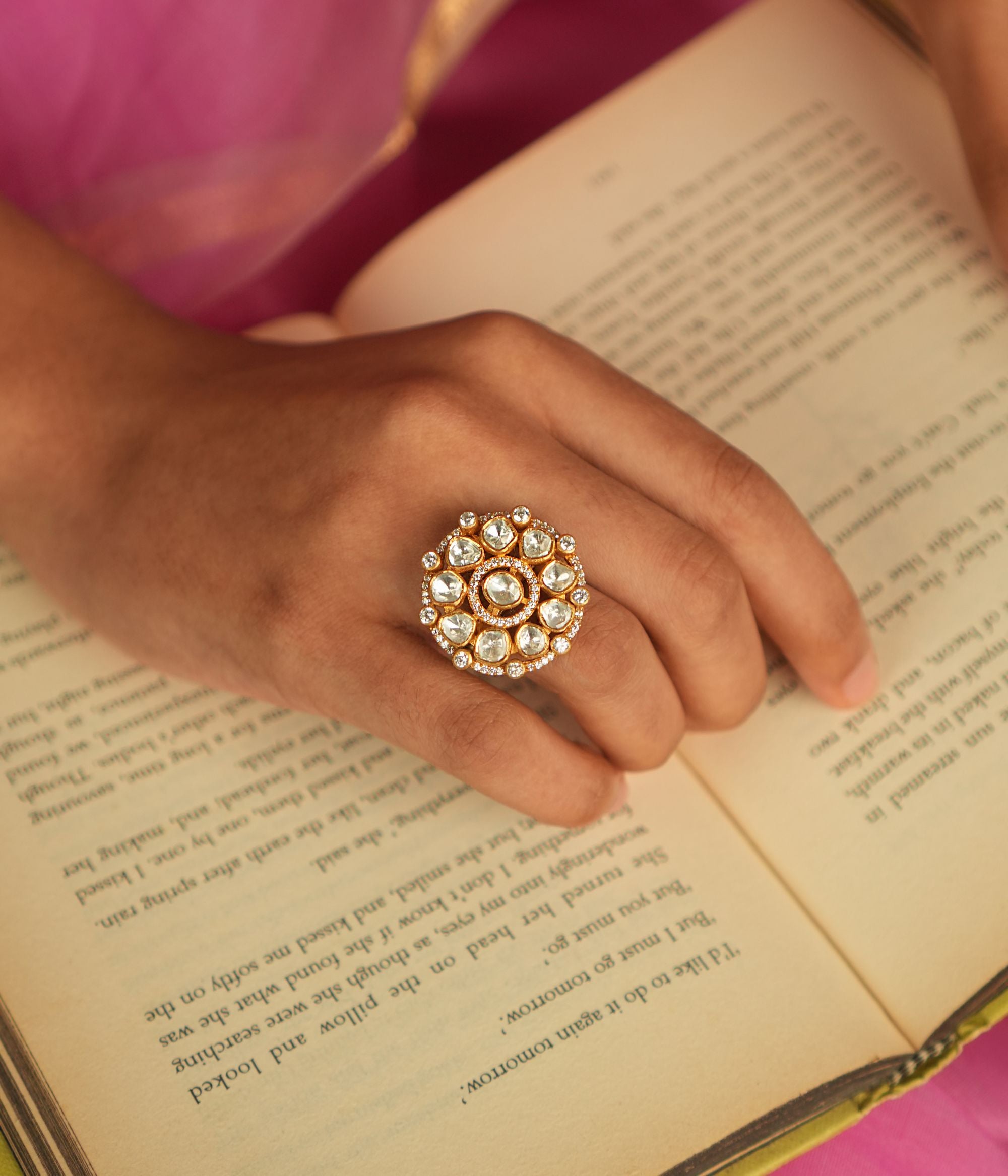 In a realm of opulence, this minimalist floral ring shines with the delicate beauty of Polki stones and the sparkle of shimmering Moissanite, creating a refined yet extravagant piece.