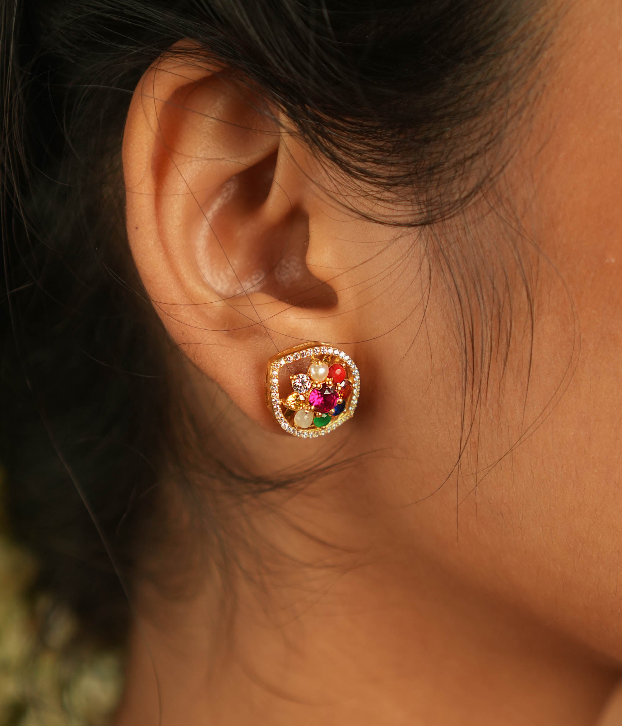 Celestial whispers reborn! Navratna and moissanite stud earrings: A symphony of stars embracing ancient wisdom, radiating timeless allure.