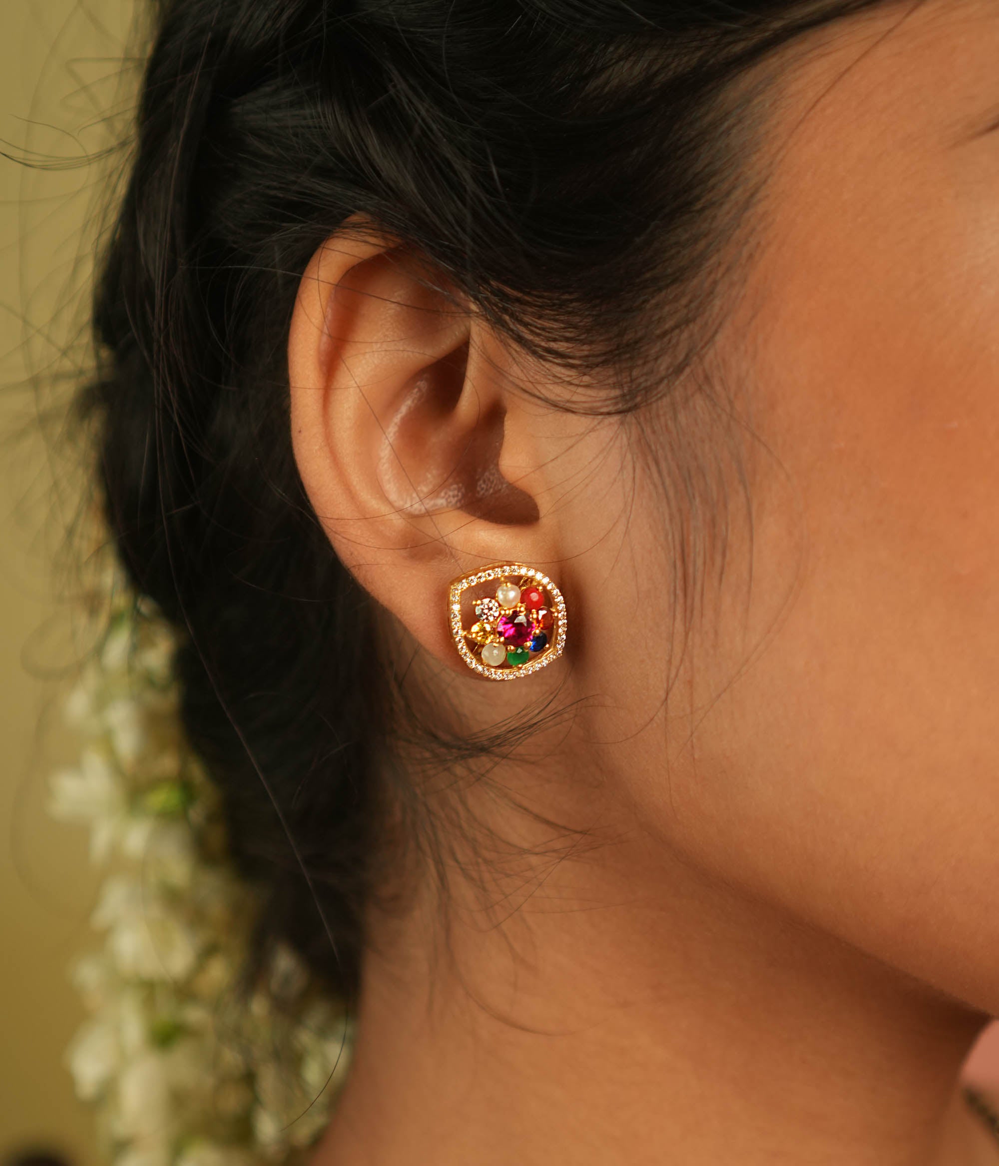 Celestial whispers reborn! Navratna and moissanite stud earrings: A symphony of stars embracing ancient wisdom, radiating timeless allure.