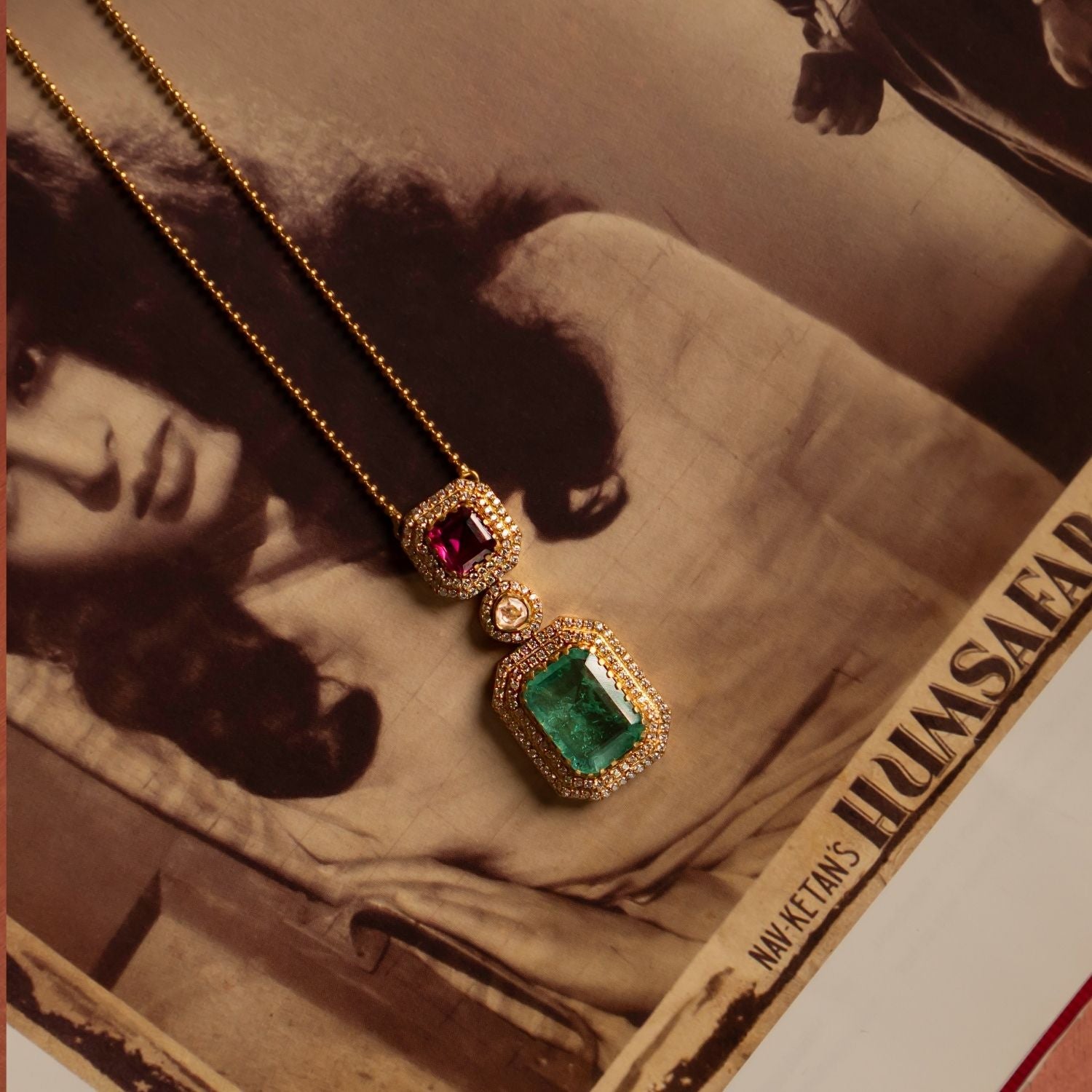 A delicate gold-plated silver jewelry piece featuring a dainty golden beaded chain with an attached pendant. The pendant showcases a captivating Pink Tourmaline stone encircled by shimmering CZ stones, complemented by a drop of Green Tourmaline elegantly surrounded by CZ stones. At the center, a radiant Moissanite Polki stone enhances the design, adding a touch of sophistication. This finely crafted piece exudes elegance and charm, making it a timeless addition to any collection.