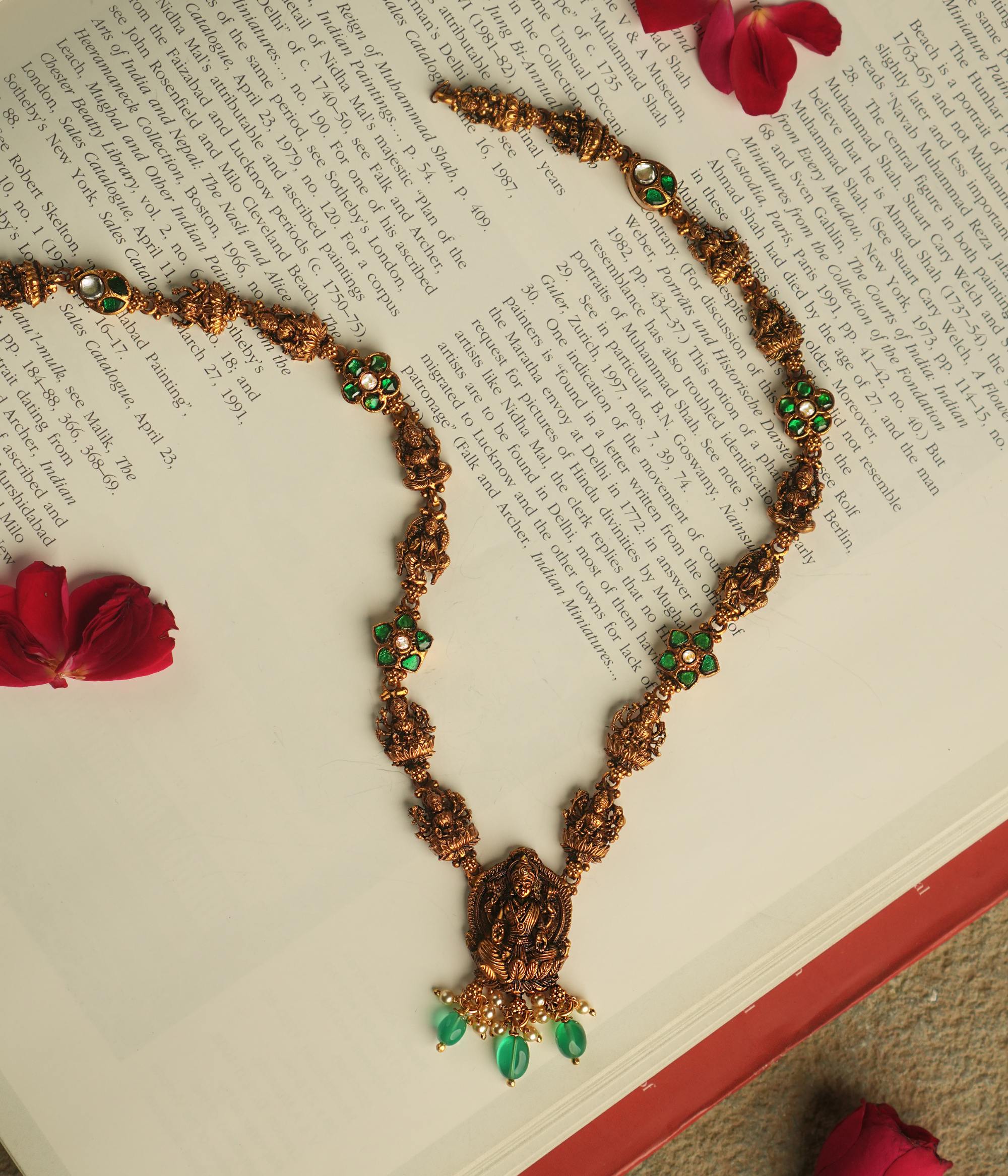 Handmade silver necklace with white and green Kundan stones, pearls, and green beads