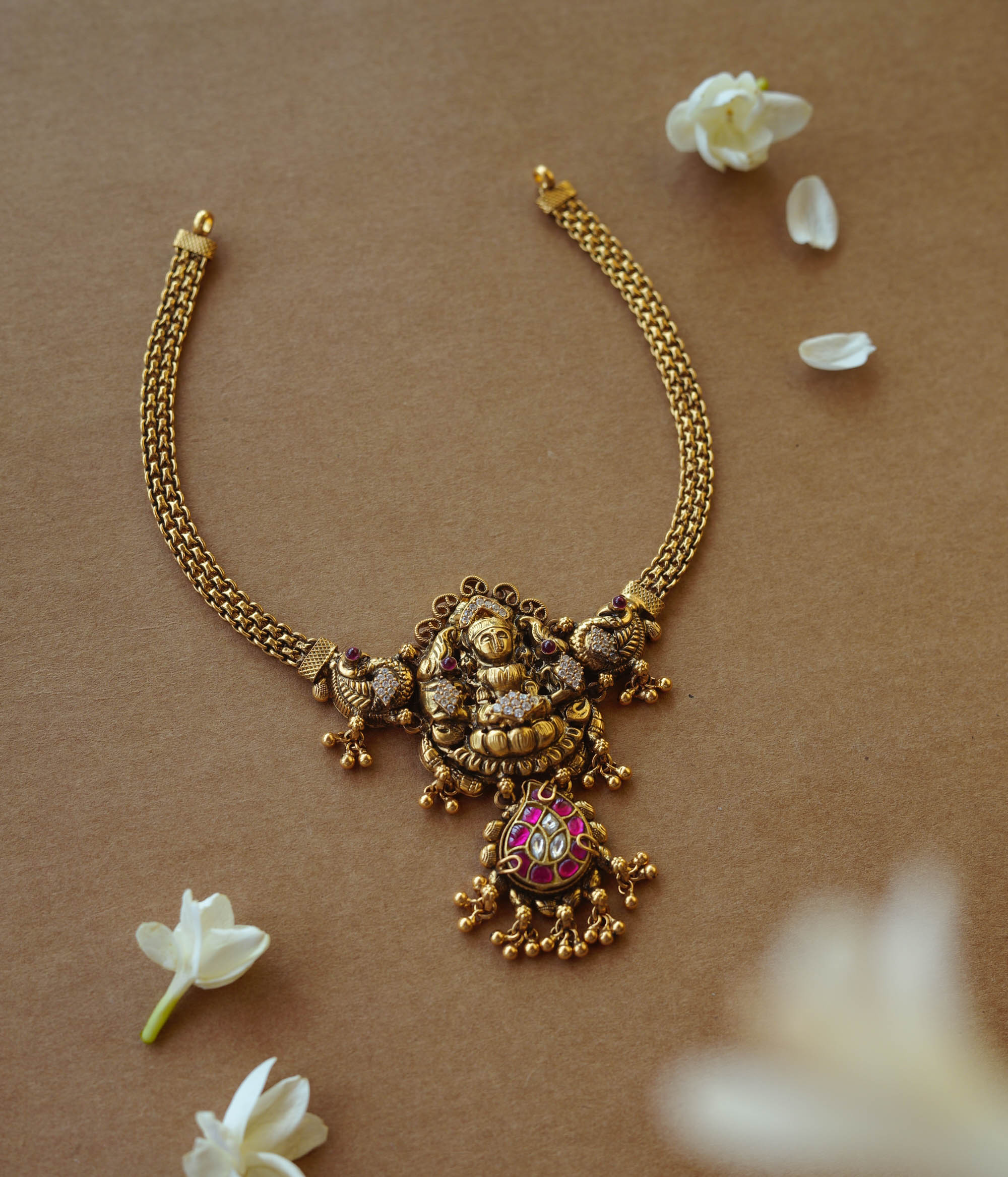 Antique gold Lakshmi temple necklace with peacock motifs, Red Spinel, Kundan, and CZ stones.
