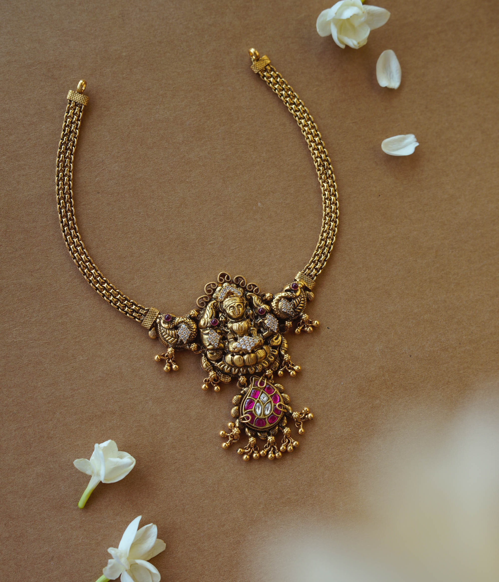 Antique gold Lakshmi temple necklace with peacock motifs, Red Spinel, Kundan, and CZ stones.