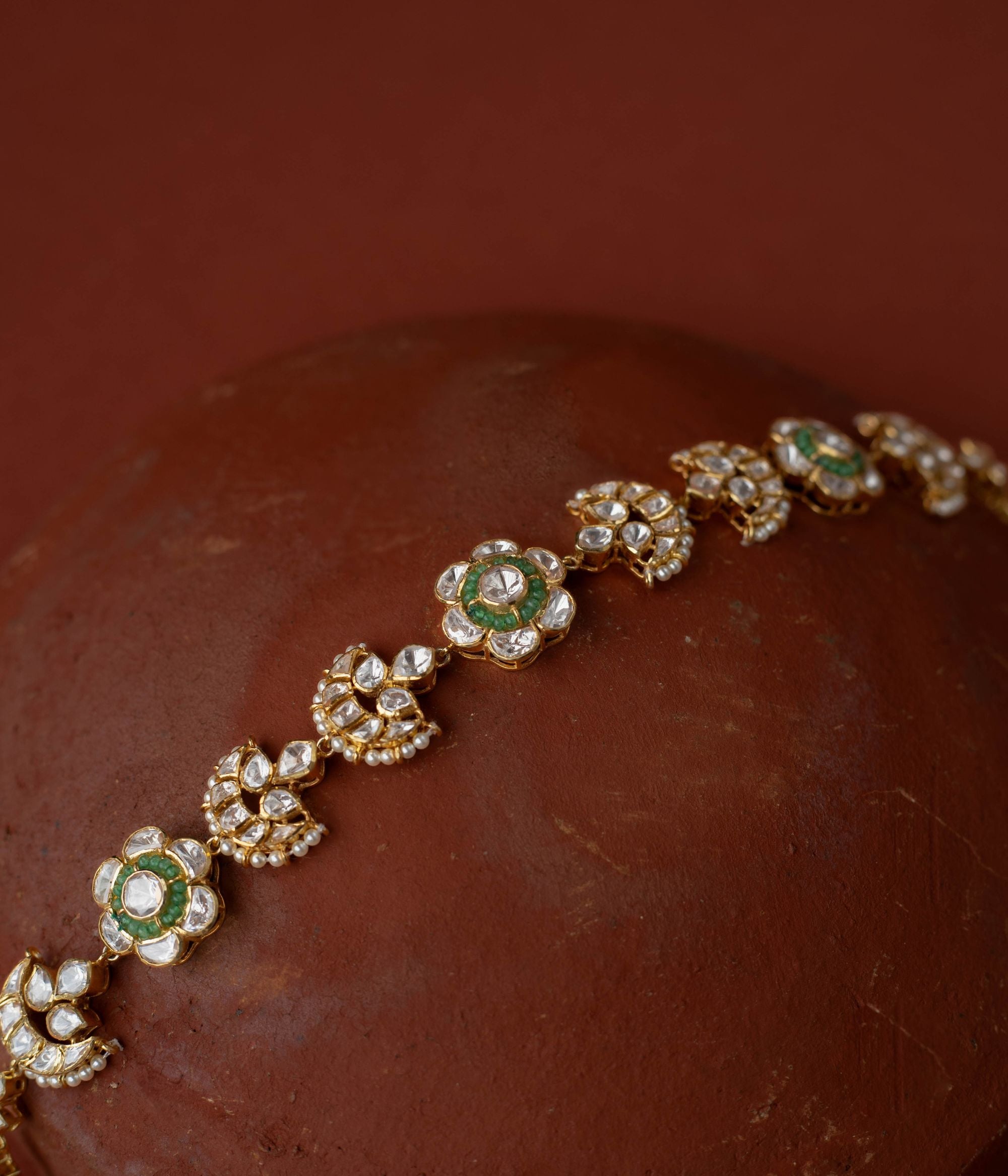 whimsical elegance with Polki and beads florals in gold-plated silver, evoking boundless stories.