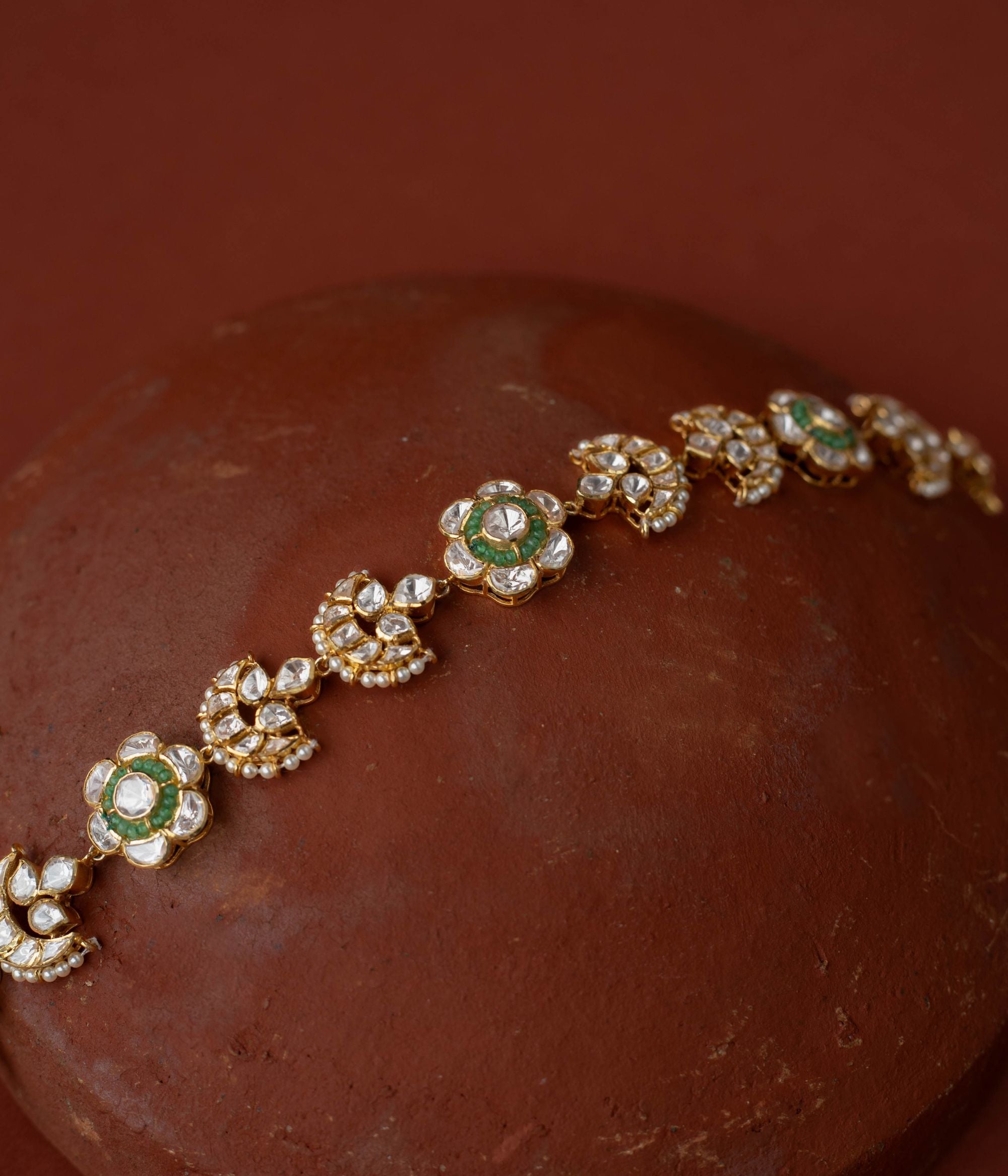 whimsical elegance with Polki and beads florals in gold-plated silver, evoking boundless stories.