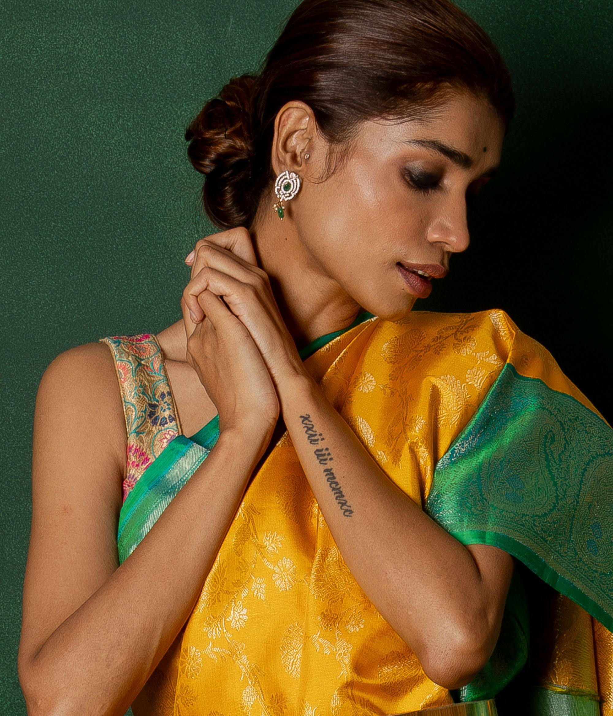 These Victorian drop earrings, crafted in silver with an antique gold finish, feature luminous green dual-lite stones, sparkling CZ stones, hydro pearls, and elegant green beads, exuding timeless sophistication.
