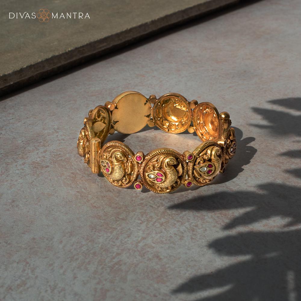 Aram Kada screw-type silver bangle with kundan stones