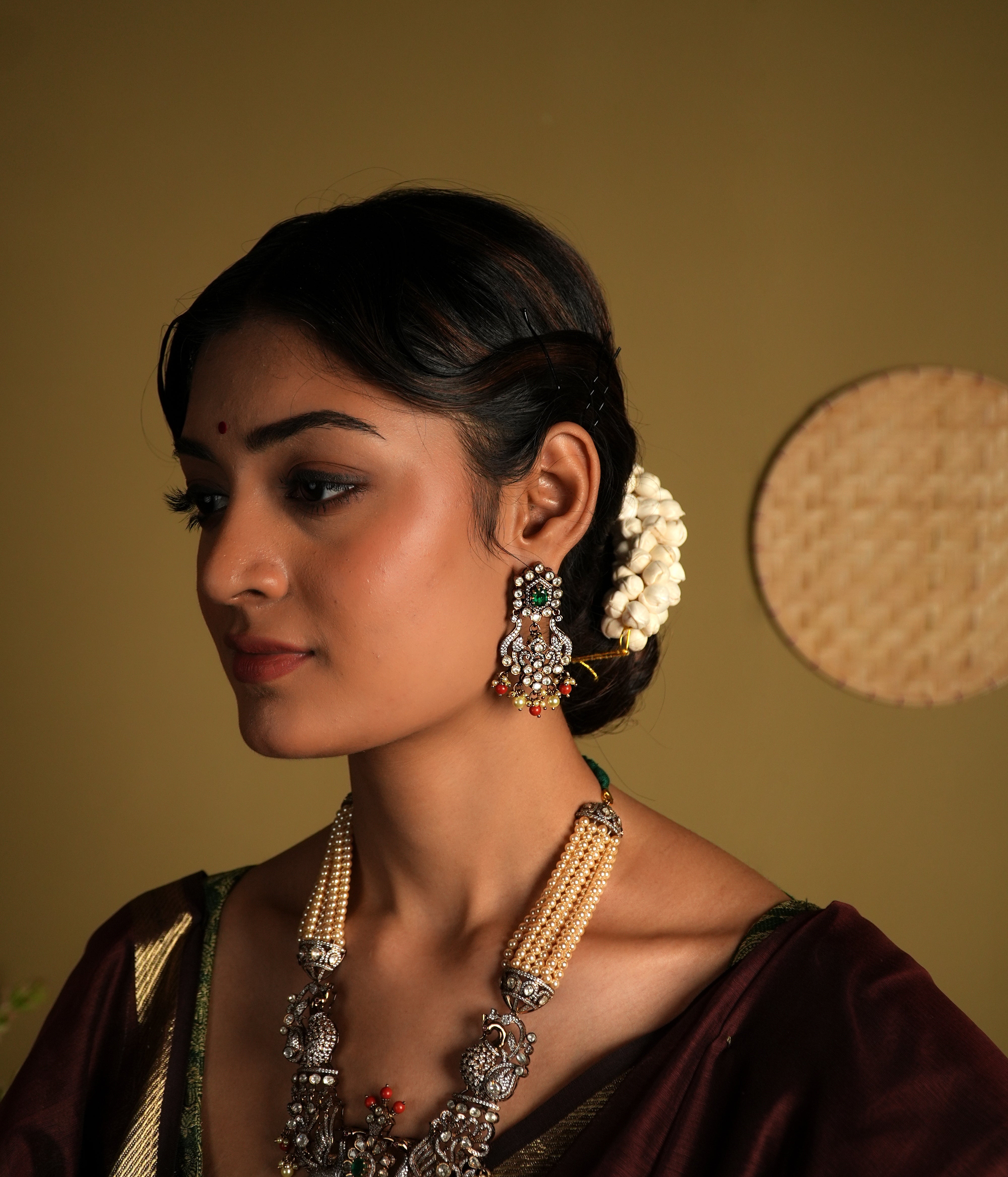 Crafted from 92.5 sterling silver, these exquisite gold-plated Victorian-style earrings feature intricate detailing with delicate floral motifs. Embellished with sparkling stones and colorful bead accents, they bring a regal charm to any traditional outfit. Perfect for weddings, festive occasions, or adding a statement to your ethnic wardrobe.