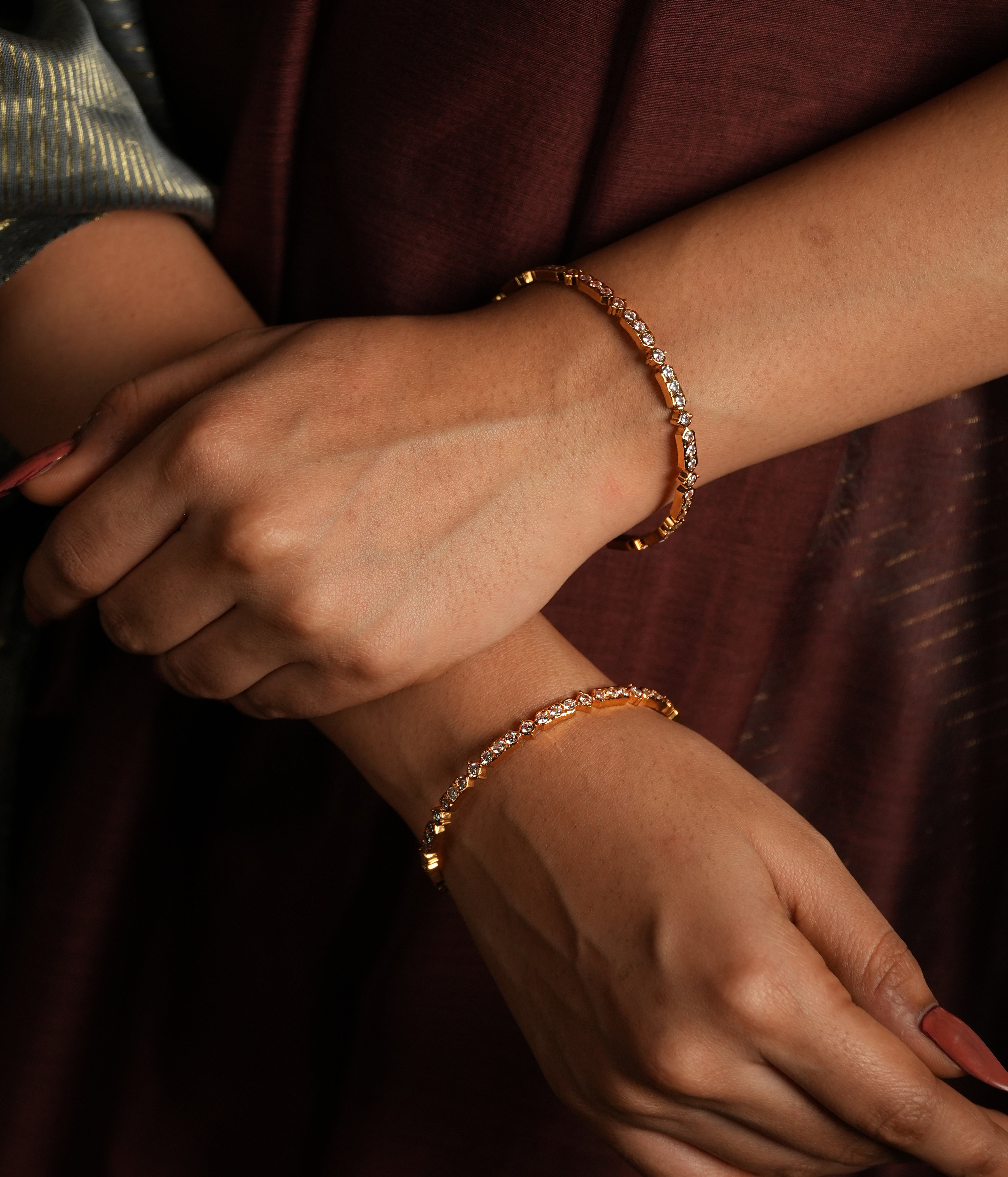 Capture the light with these stunning bangle bracelets, meticulously crafted with dazzling Swarovski crystals.  Each bangle showcases a delicate row of brilliantly faceted crystals, catching and reflecting light with every movement.