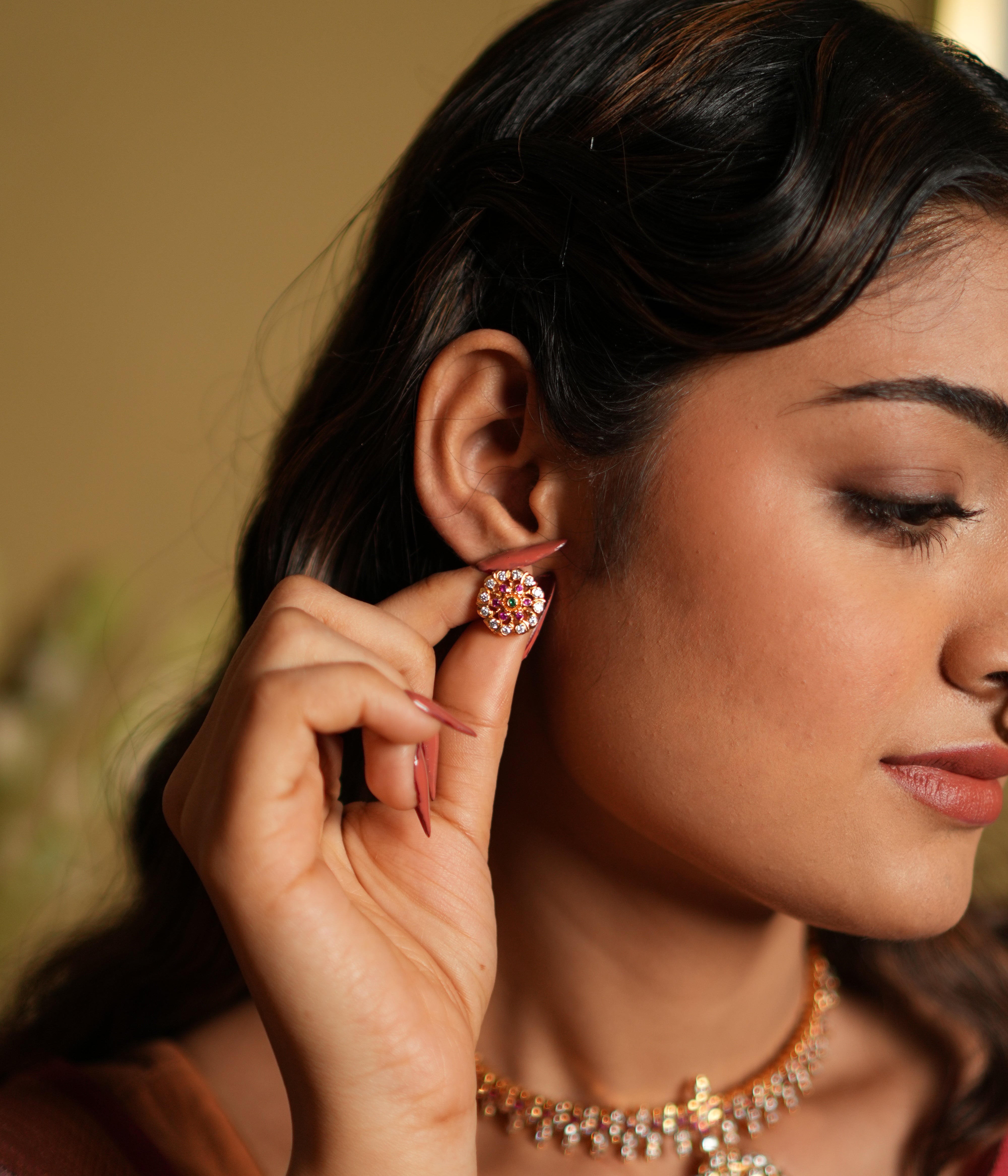 Add a touch of timeless elegance to your look with these beautifully crafted stud earrings made from 92.5 sterling silver and finished with a radiant 22-carat gold plating. The round design features a cluster of vivid pink gemstones accented by brilliant white stones, creating a stunning contrast that catches the light effortlessly