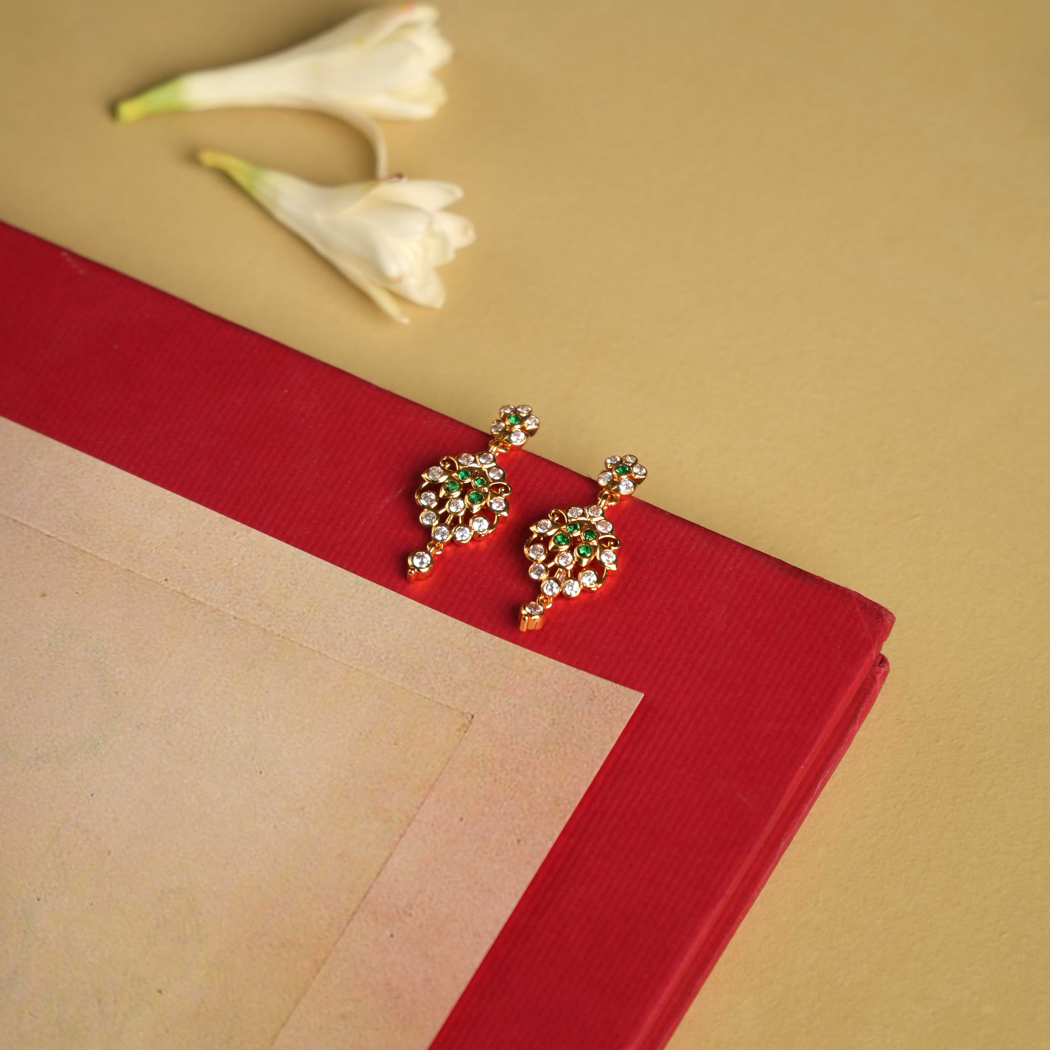 92.5 sterling silver earrings with South screw fastenings, featuring moissanite, green cut stones, and Swarovski crystals, inspired by the elegant heritage of Chettinad designs.