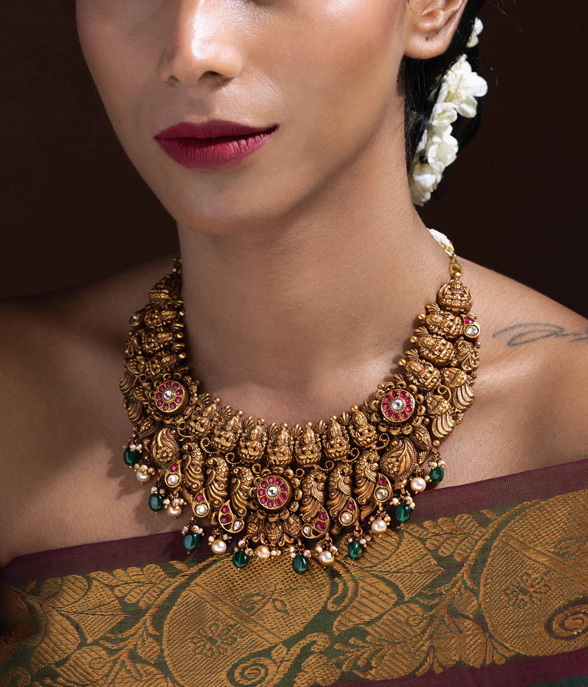 Handcrafted 92.5 silver and gold-plated Aarna necklace with pearls,Red Kundan and green bead adorned Aarna Nakshi silver necklace

