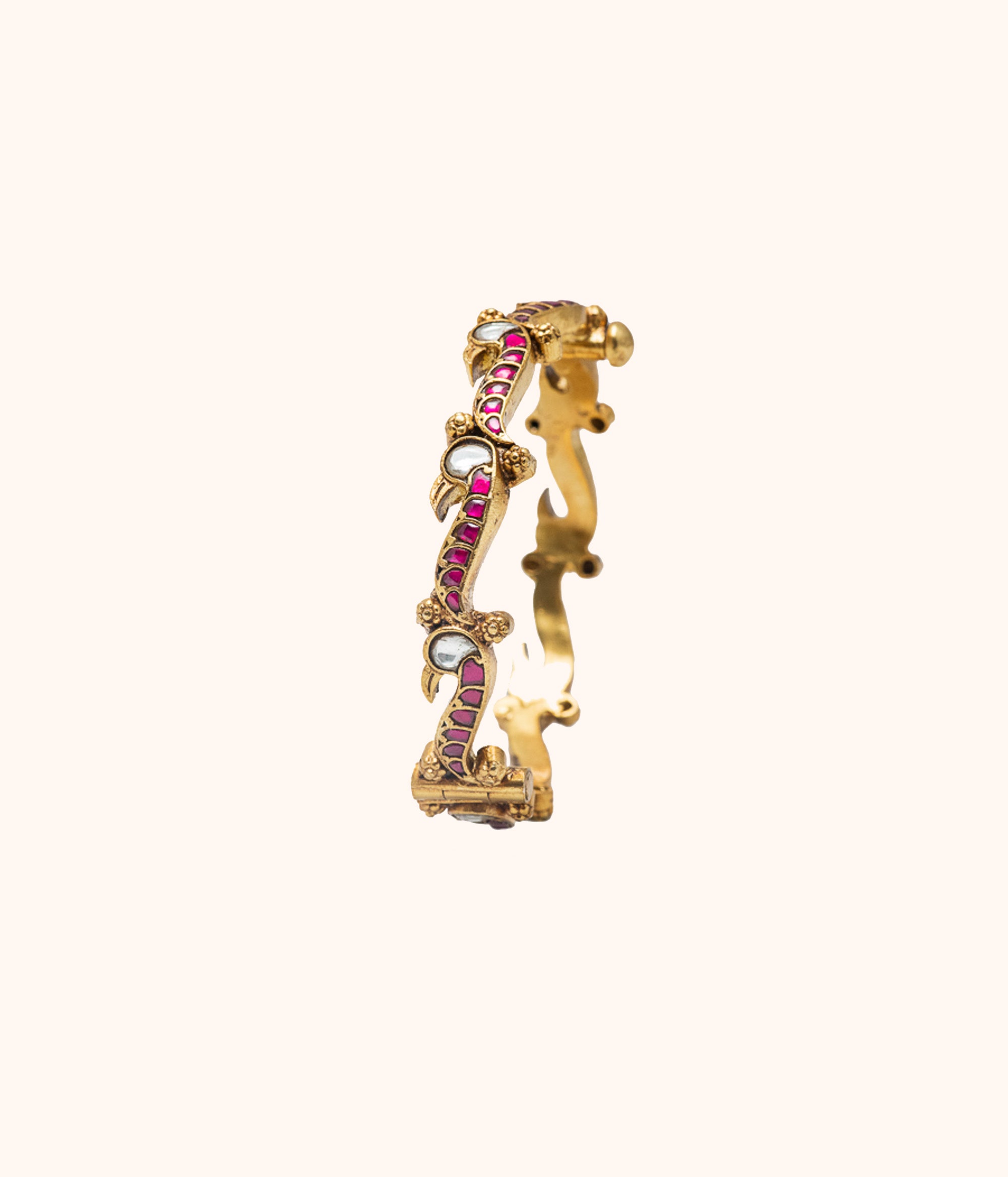 Antique peacock-inspired silver bangle with kundan stones from DivasMantra – top jewelry pick in Chennai
