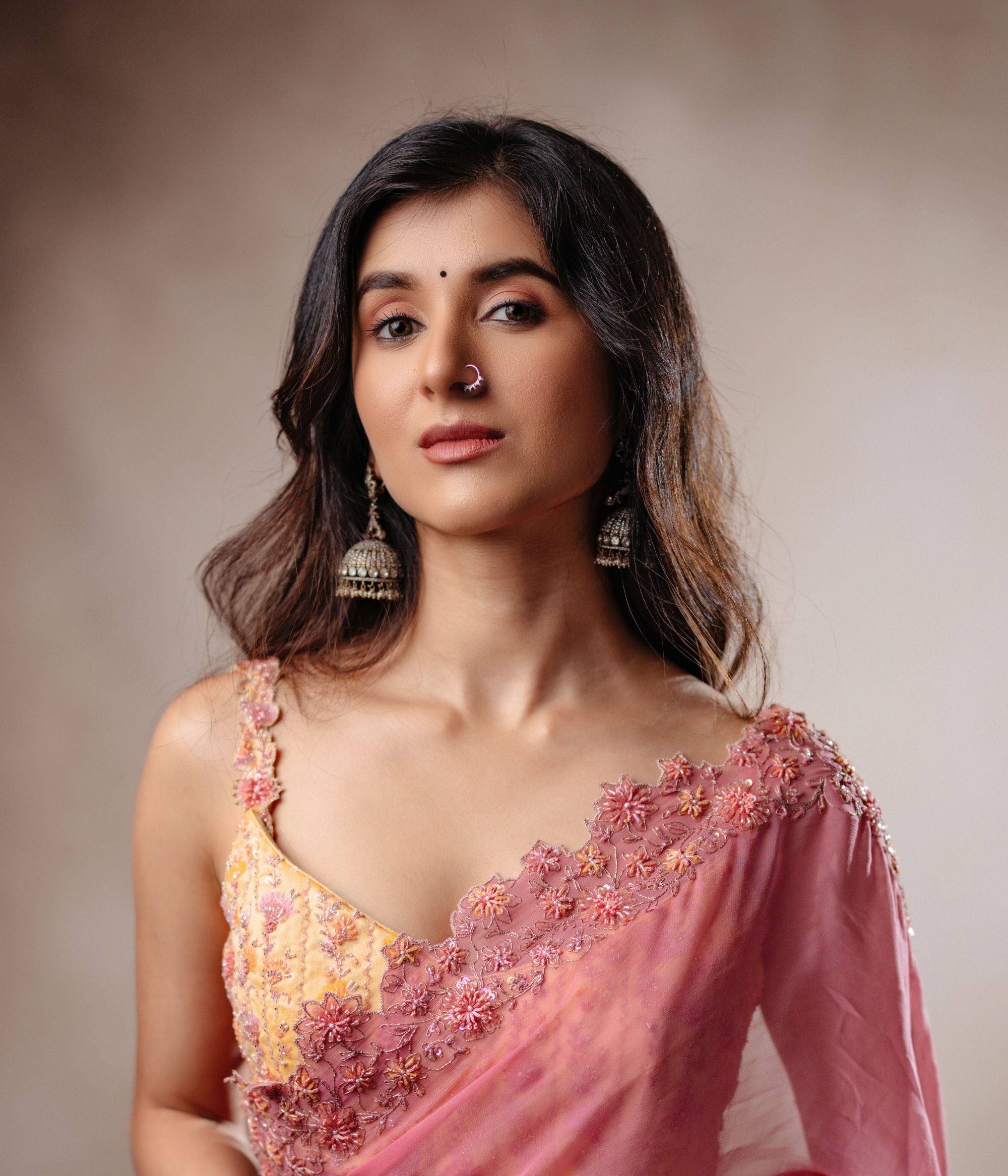 The Aruna Victorian Jhumka seamlessly fuses vintage charm with contemporary elegance, showcasing green duality stones, hydro pearls, and CZ stones set in antiqued sterling silver.
