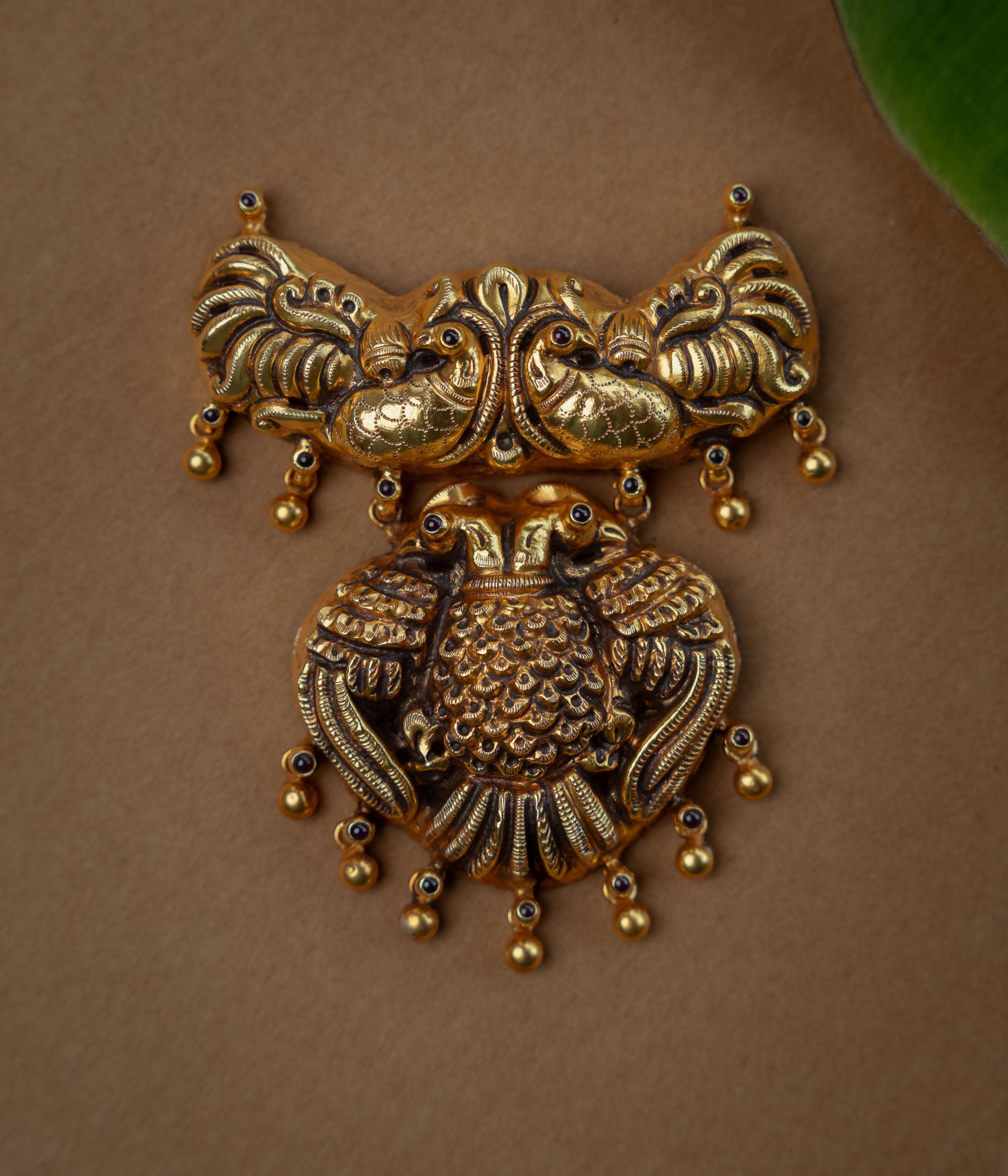Temple Pendant with Red Spinal Stone, themed around Peacock.