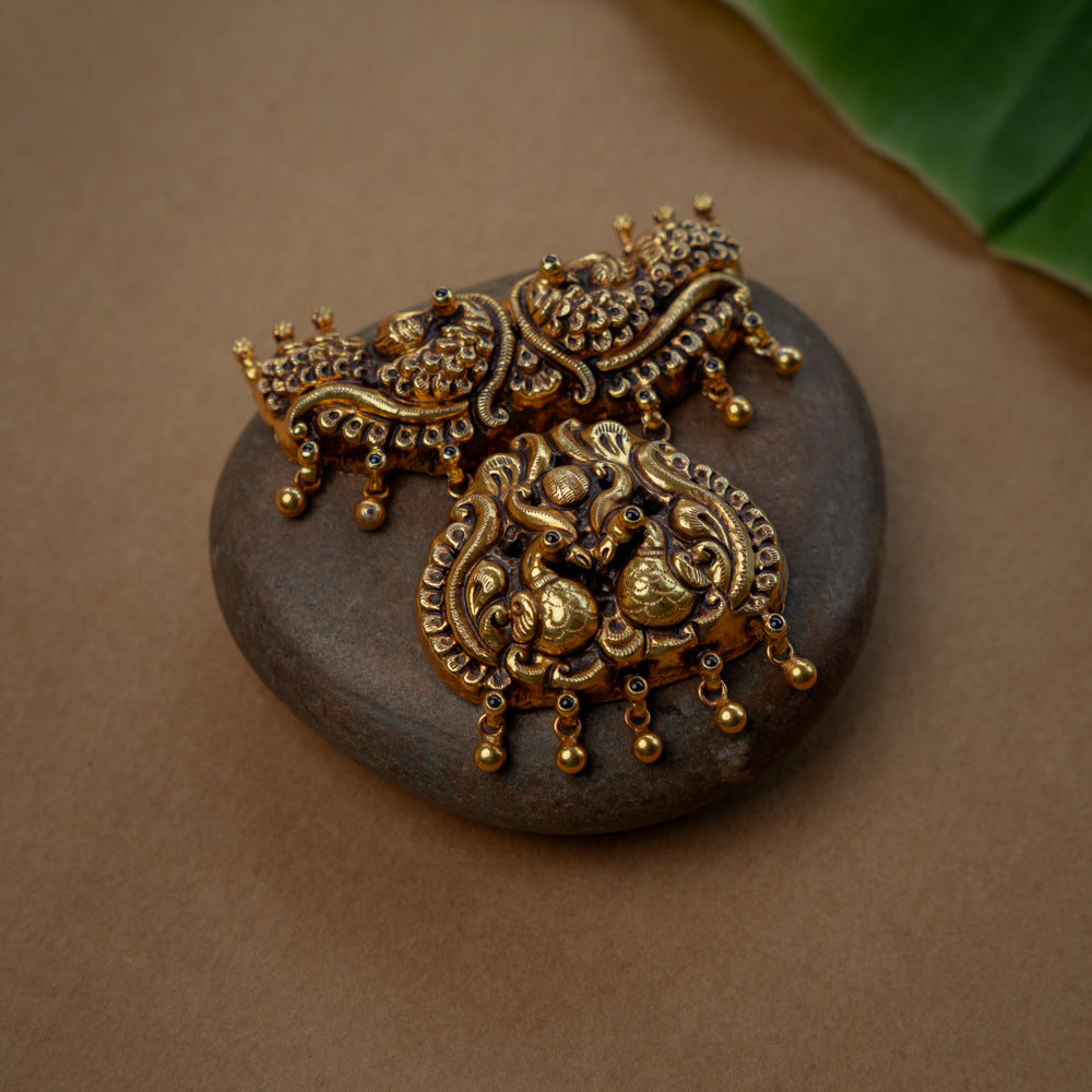 Temple Pendant with Red Spinal Stone, themed around Floral.