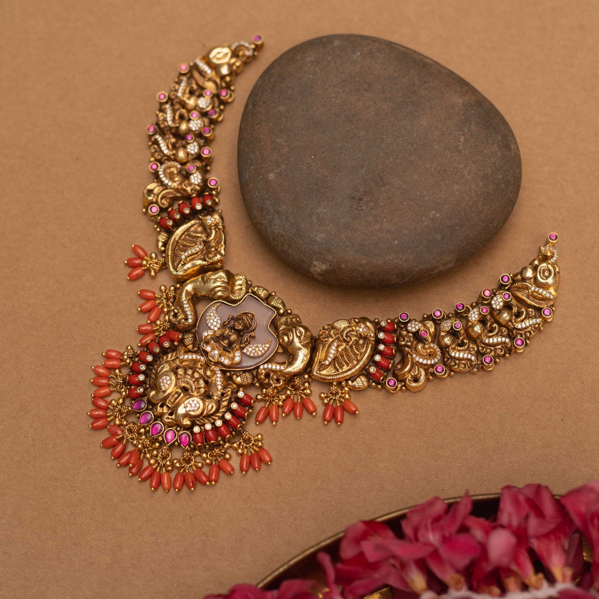 Antique gold-finished 92.5 sterling silver Nakshi necklace featuring intricately handcrafted mythical creatures and traditional motifs with vibrant gemstones, exuding timeless artistry and spiritual grace.