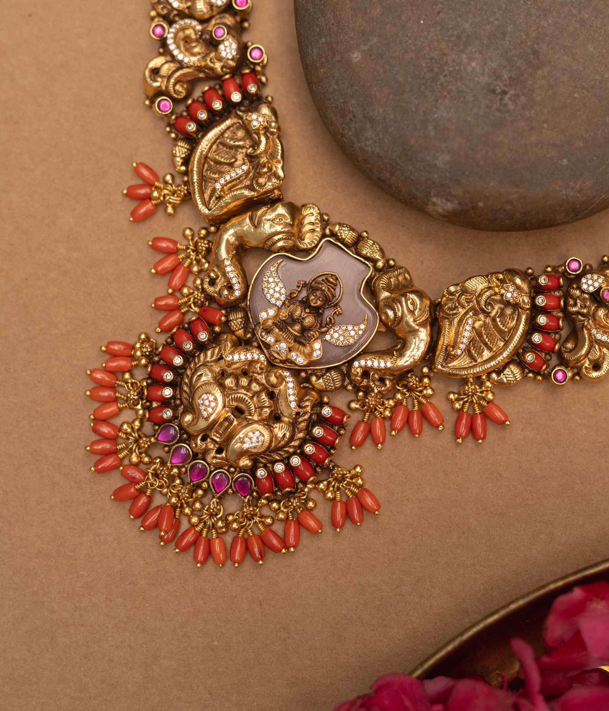 Antique gold-finished 92.5 sterling silver Nakshi necklace featuring intricately handcrafted mythical creatures and traditional motifs with vibrant gemstones, exuding timeless artistry and spiritual grace.