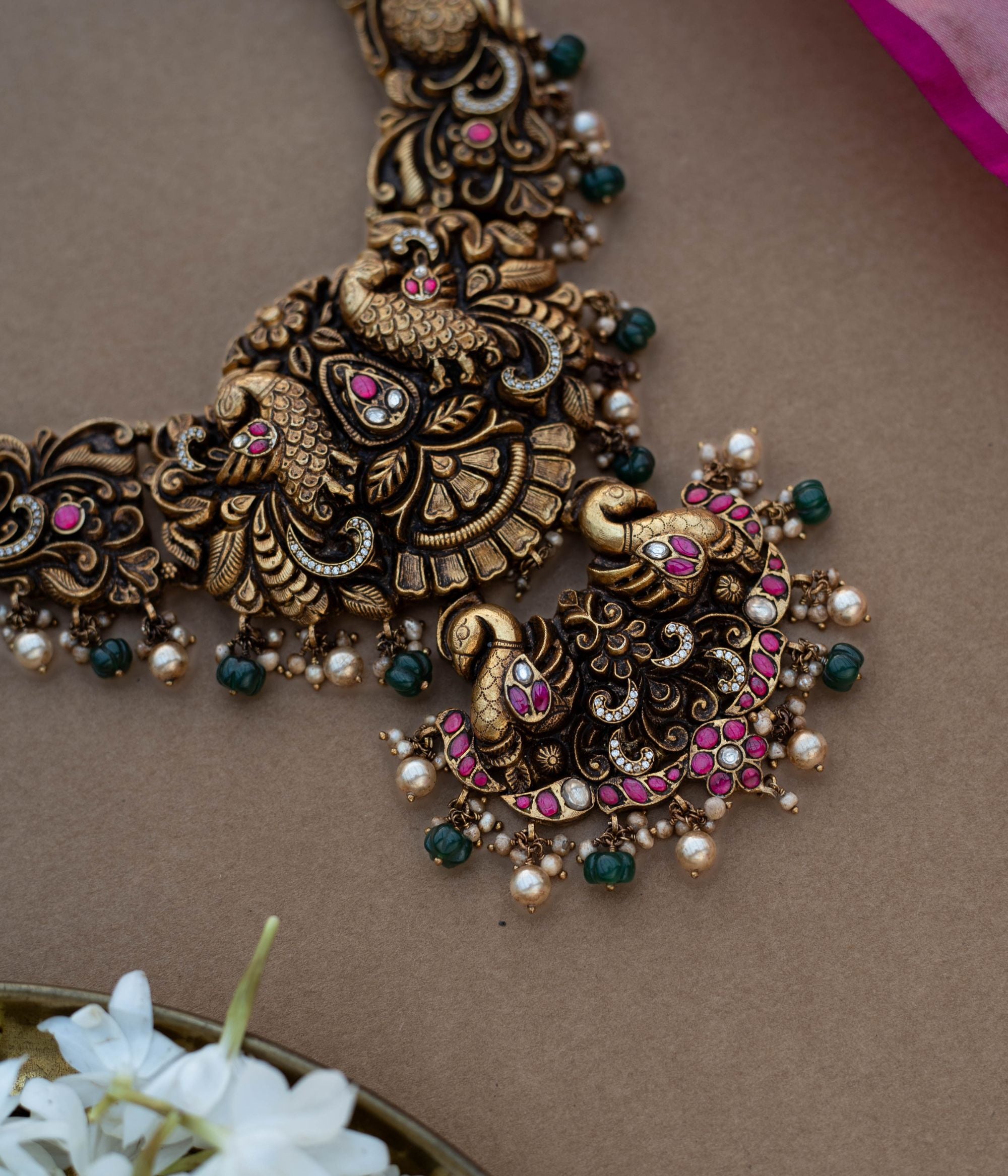 Traditional Malligai Charm Temple Choker in 92.5 Sterling Silver and 22ct Gold Plated, featuring Red Kundan, Green Kundan, White Kundan stones and Pearls, with intricate pearl and golden bead danglings