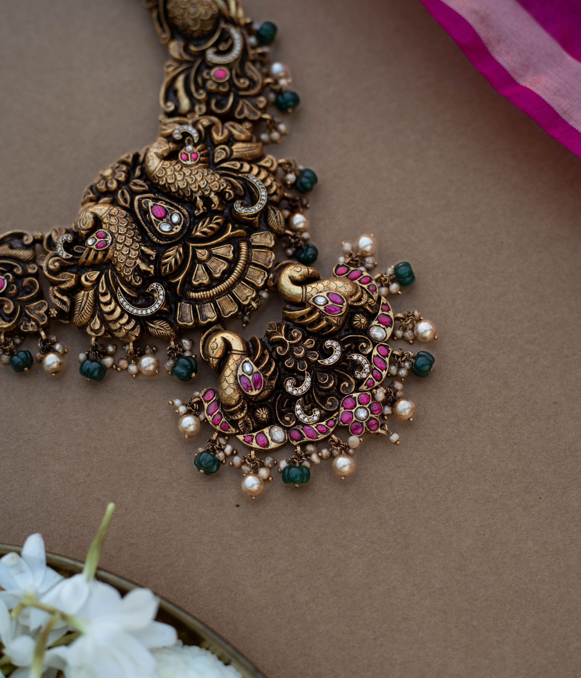 Traditional Malligai Charm Temple Choker in 92.5 Sterling Silver and 22ct Gold Plated, featuring Red Kundan, Green Kundan, White Kundan stones and Pearls, with intricate pearl and golden bead danglings