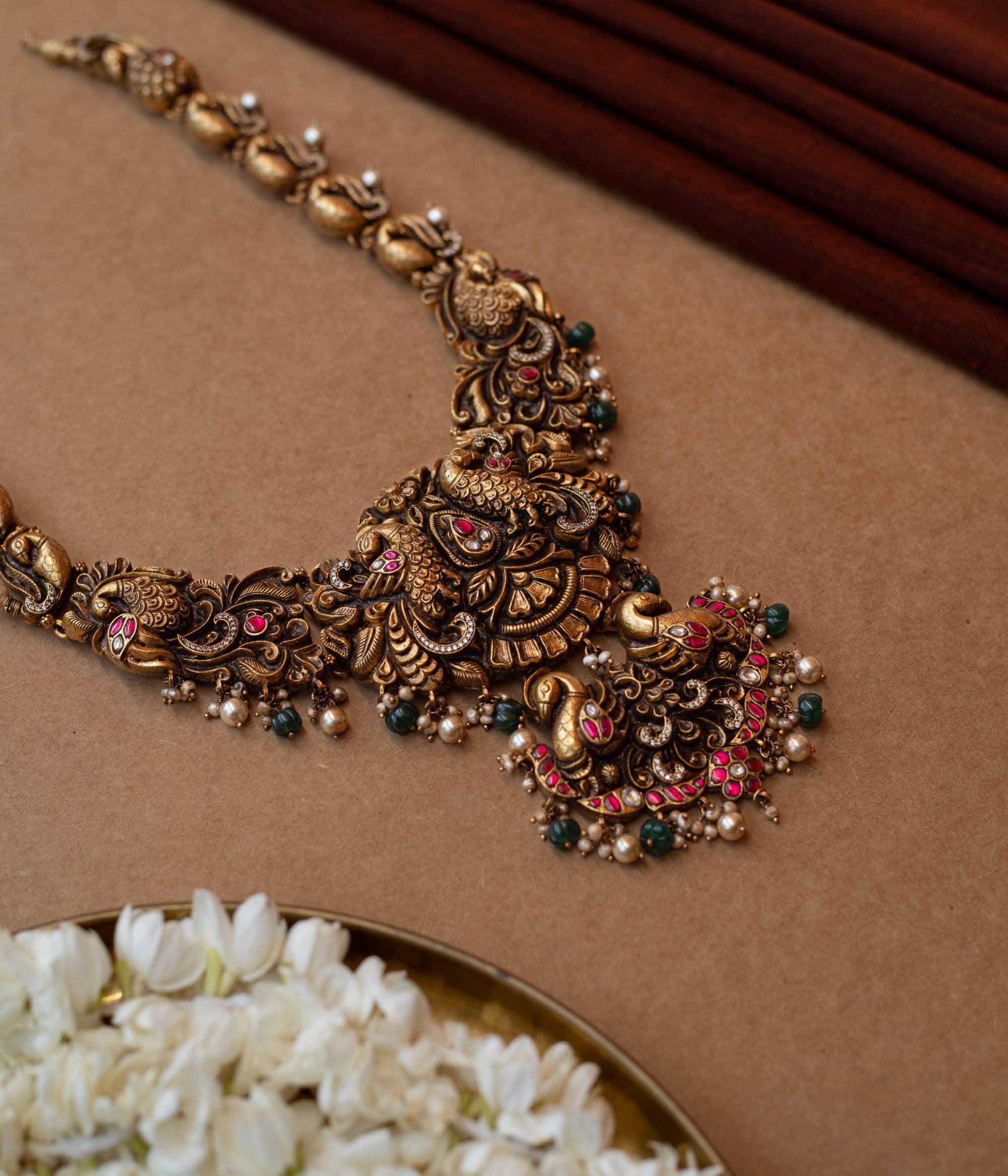 Handmade Rakni silver necklace with intricate temple-inspired pattern for bridal wear