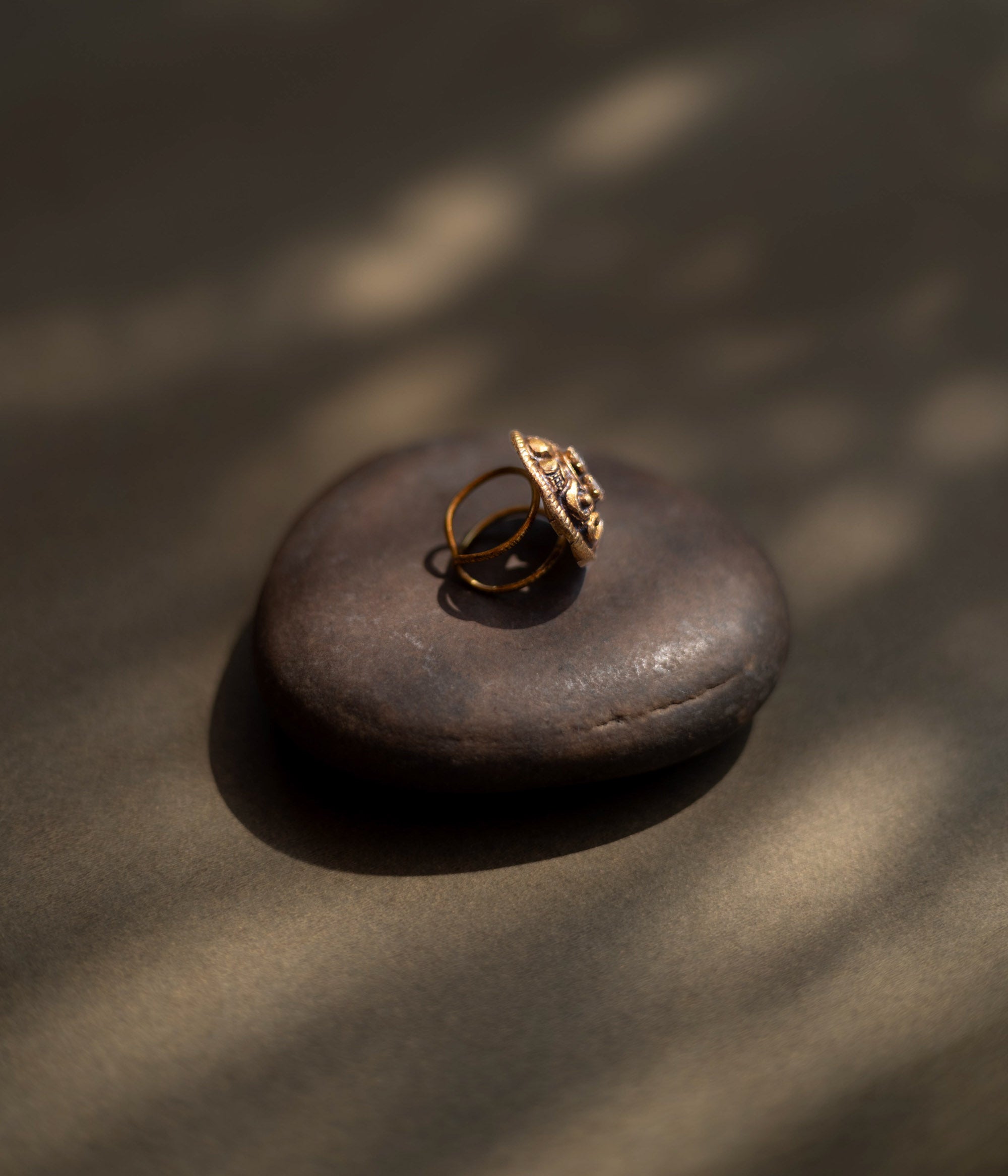 Antique gold-toned ring with ornate floral motif and radiant central mirror stones" is well-suited for the product description of the "Eternal Blossom Antique Ring."