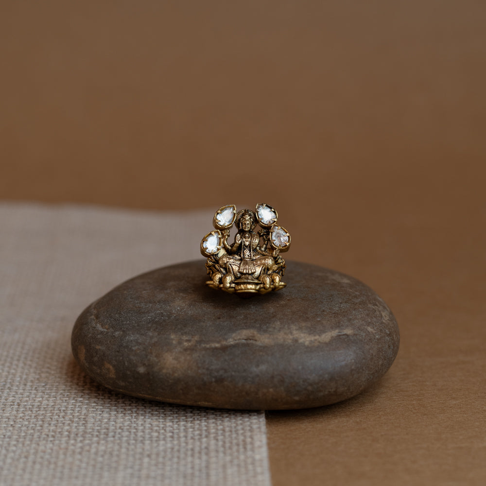 Temple collection ring with white Polki stone in circular motif, traditional and elegant design.