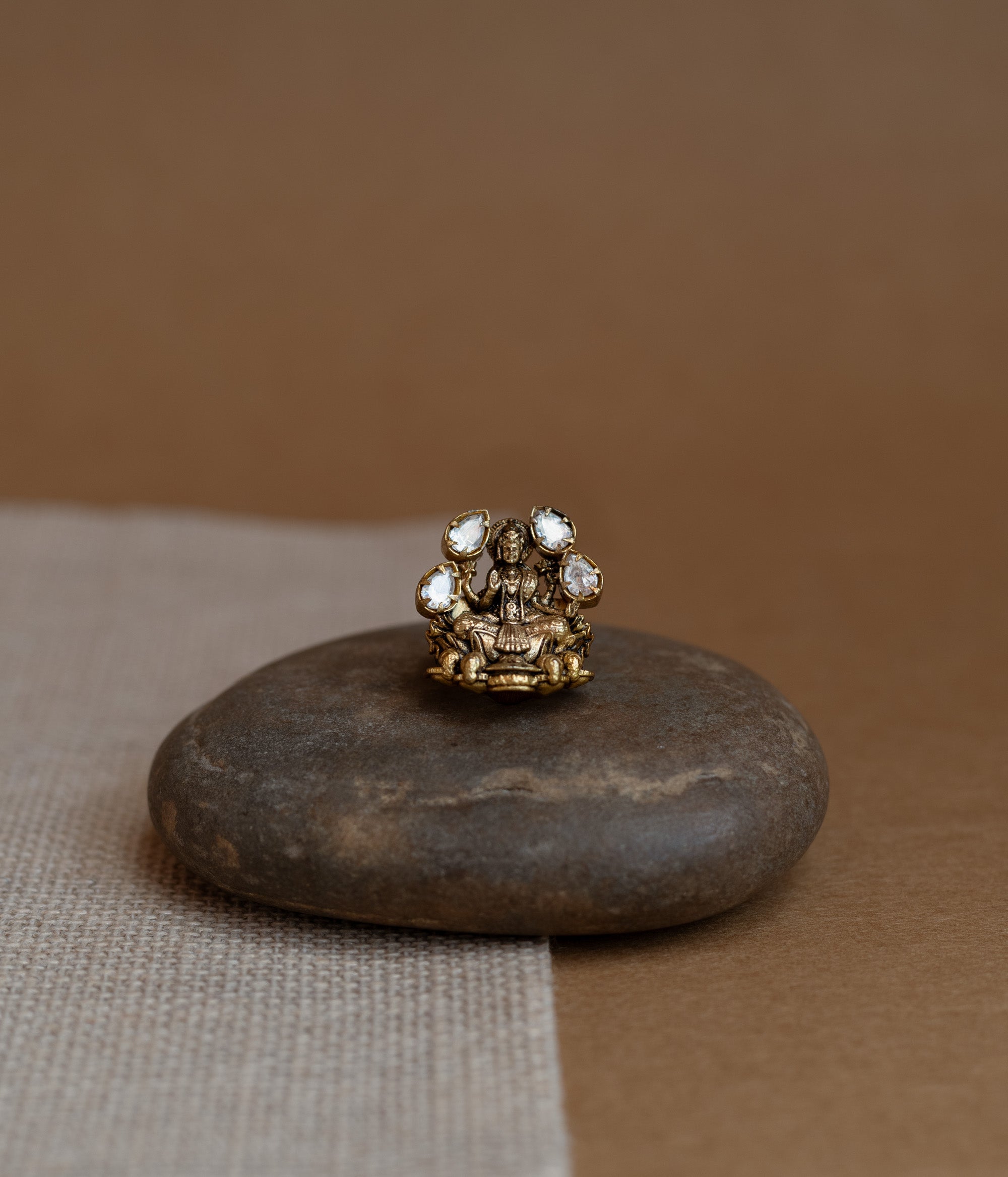 Temple collection ring with white Polki stone in circular motif, traditional and elegant design.