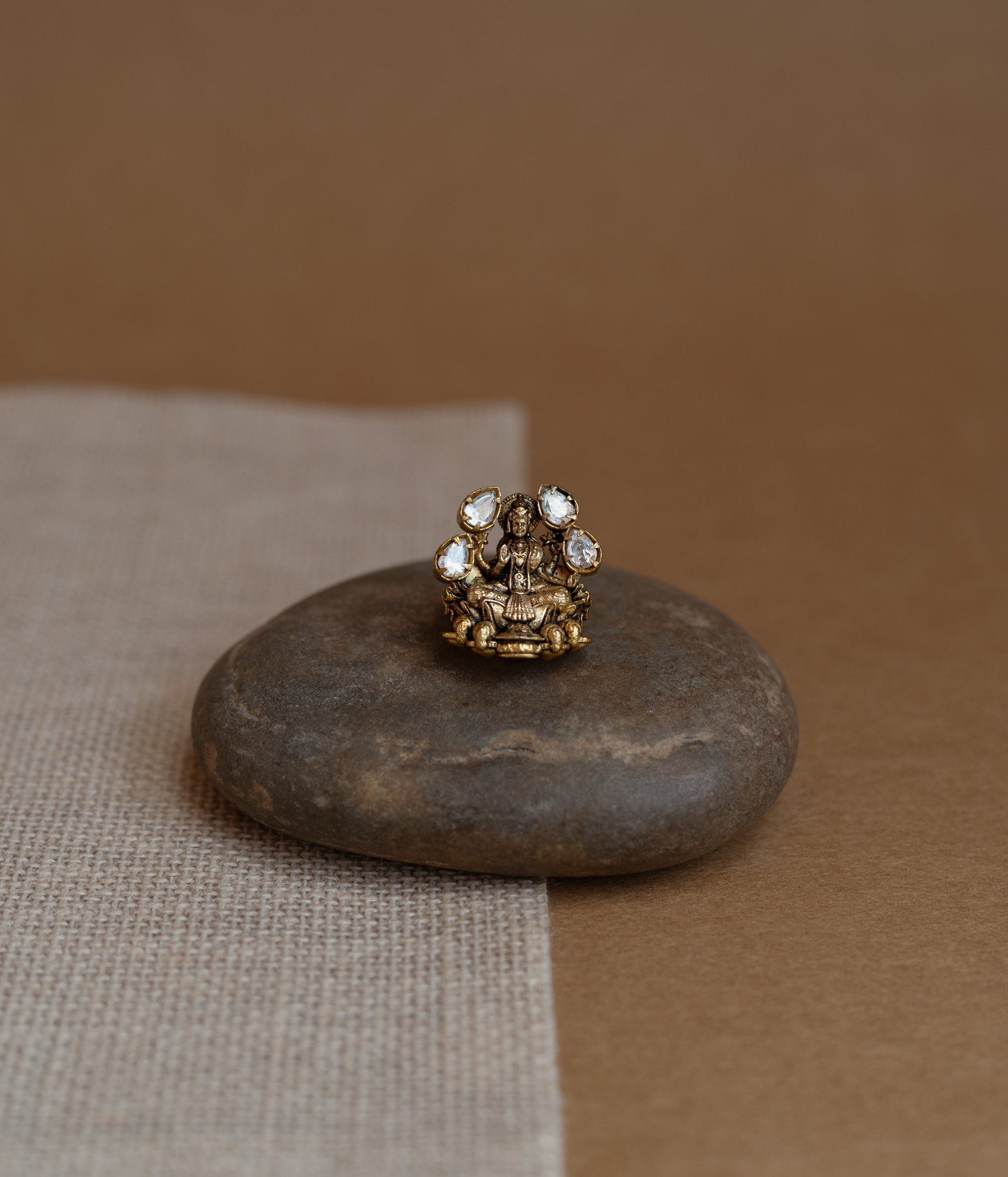 Temple collection ring with white Polki stone in circular motif, traditional and elegant design.
